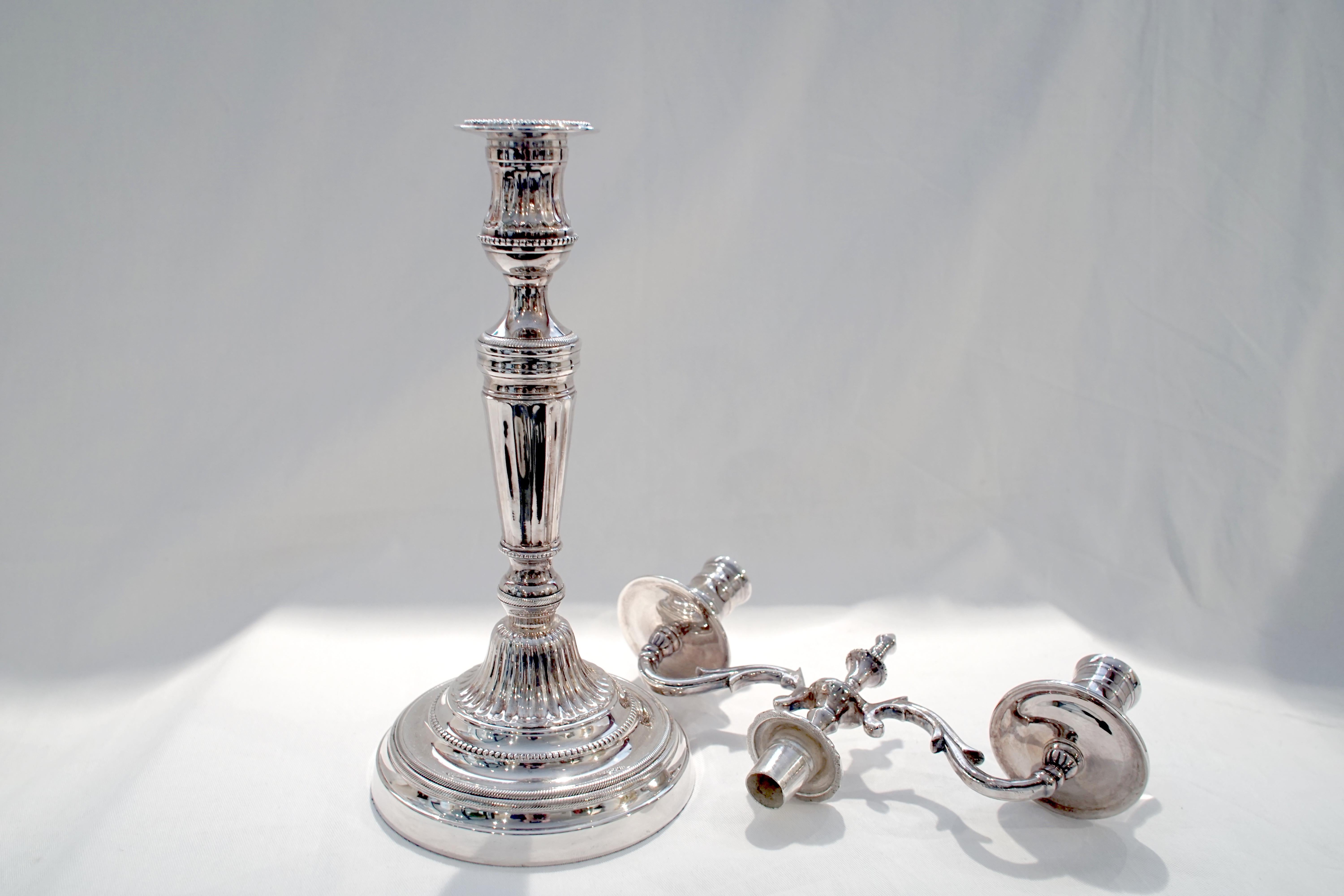 Double branched silver candlestick

Dimensions: 15.5” H x 10.5” W x 5.5” D
Base diameter 5.5”.