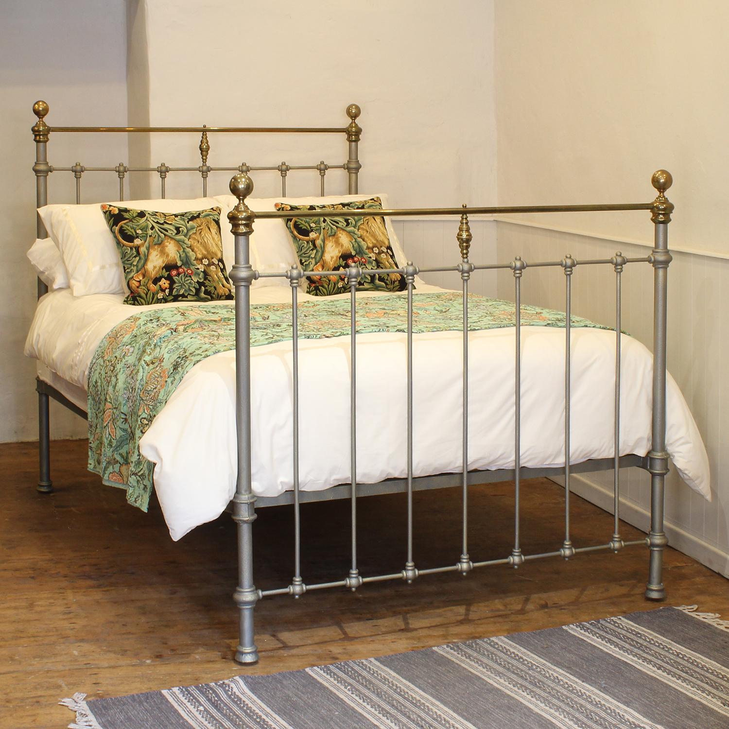 A classic style antique bed in green and gold with straight brass top rail, simple castings, and round brass knobs.

This bed accepts a double size (4ft 6in, 54in or 135cm wide) base and mattress set.

The price includes a standard firm bed base to
