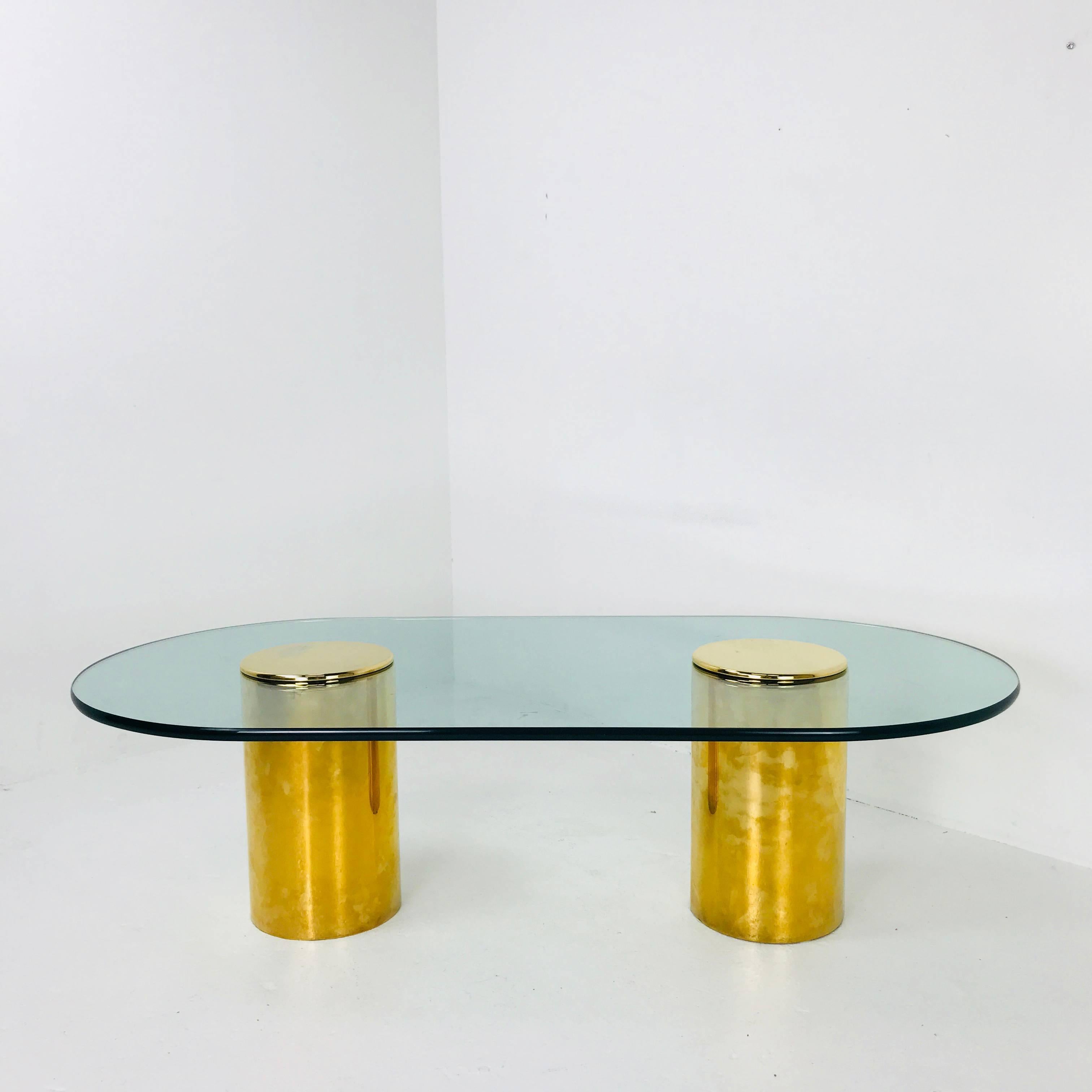 Double brass Pedestals coffee table by Directional. Table is in good vintage condition with wear due to age and use. 

Dimensions:
60