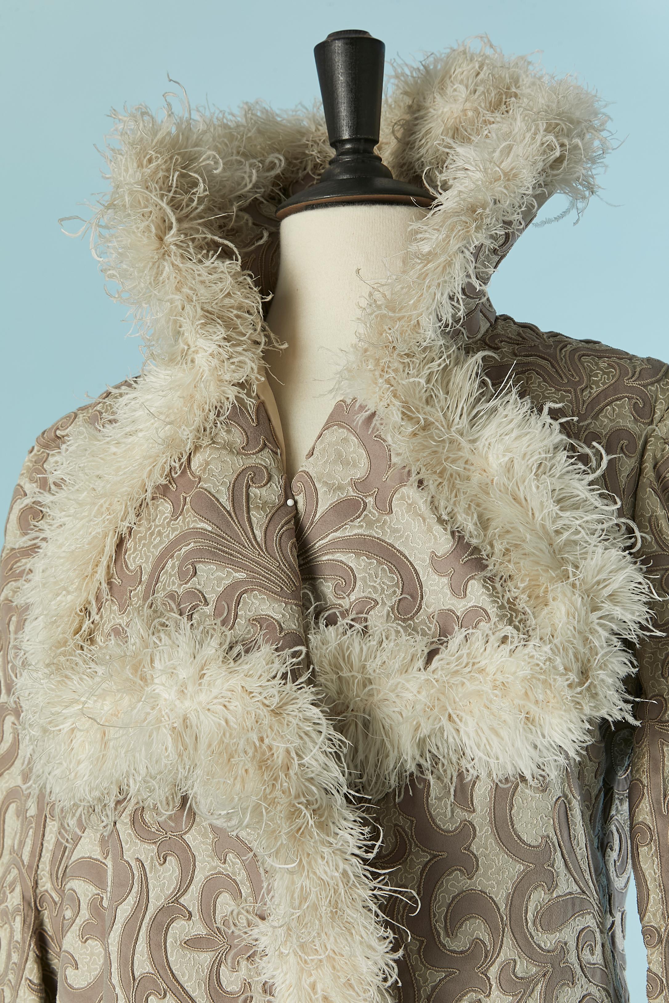 Double breasted Opera coat with wool cut-work appliqué. Button covered with fabric and buttonhole closure. Pocket inside with pleated edge. 
SIZE L 