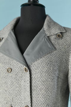 Double breasted skirt suit in tweed with chevron pattern COURREGES