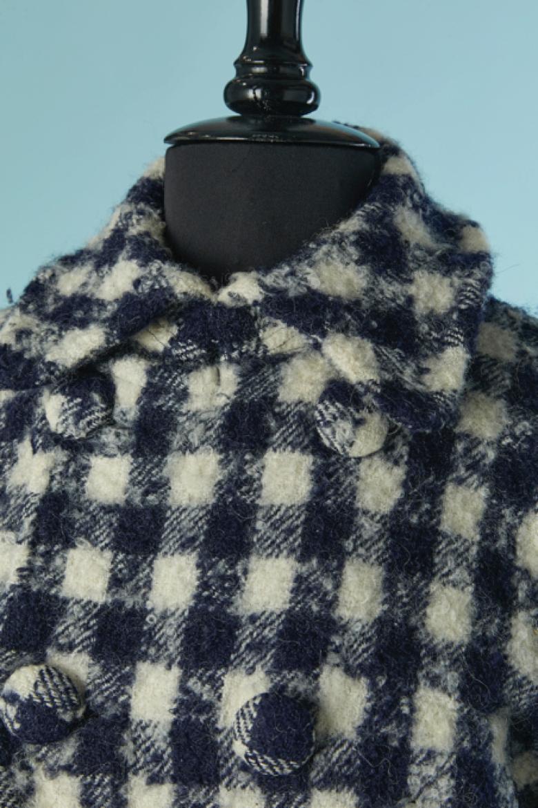 Double breasted wool ( 90%) and nylon ( 10%)  jacket with check pattern . Cupro lining. Pocket on both side.
SIZE S on tag but also M 