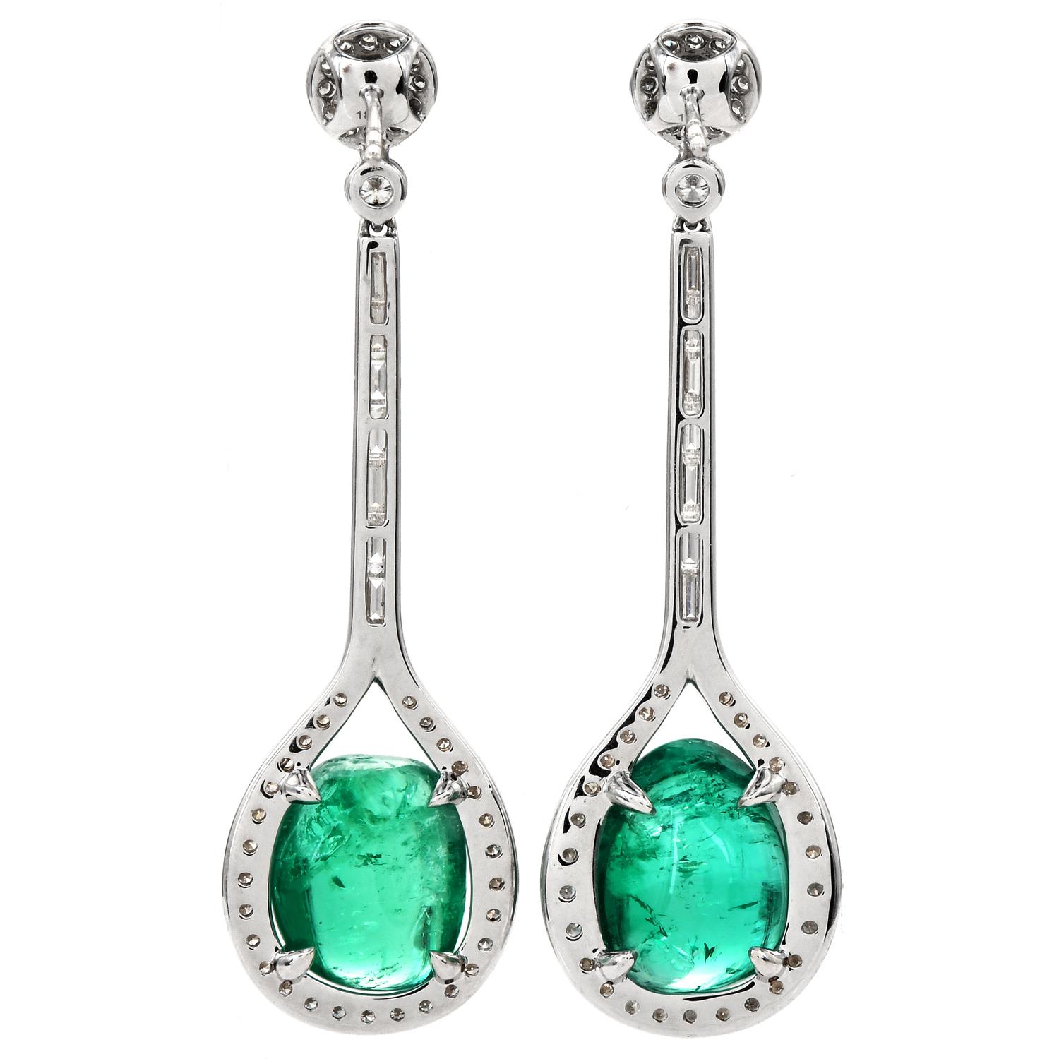 Stand out with these Emerald Gold Cabochon Drop Dangle Earrings.  These earrings are crafted in 18-karat white gold. 

There are two genuine double cabochons emeralds, weighing

approximately 19.63 in total carats

There are glittering With some