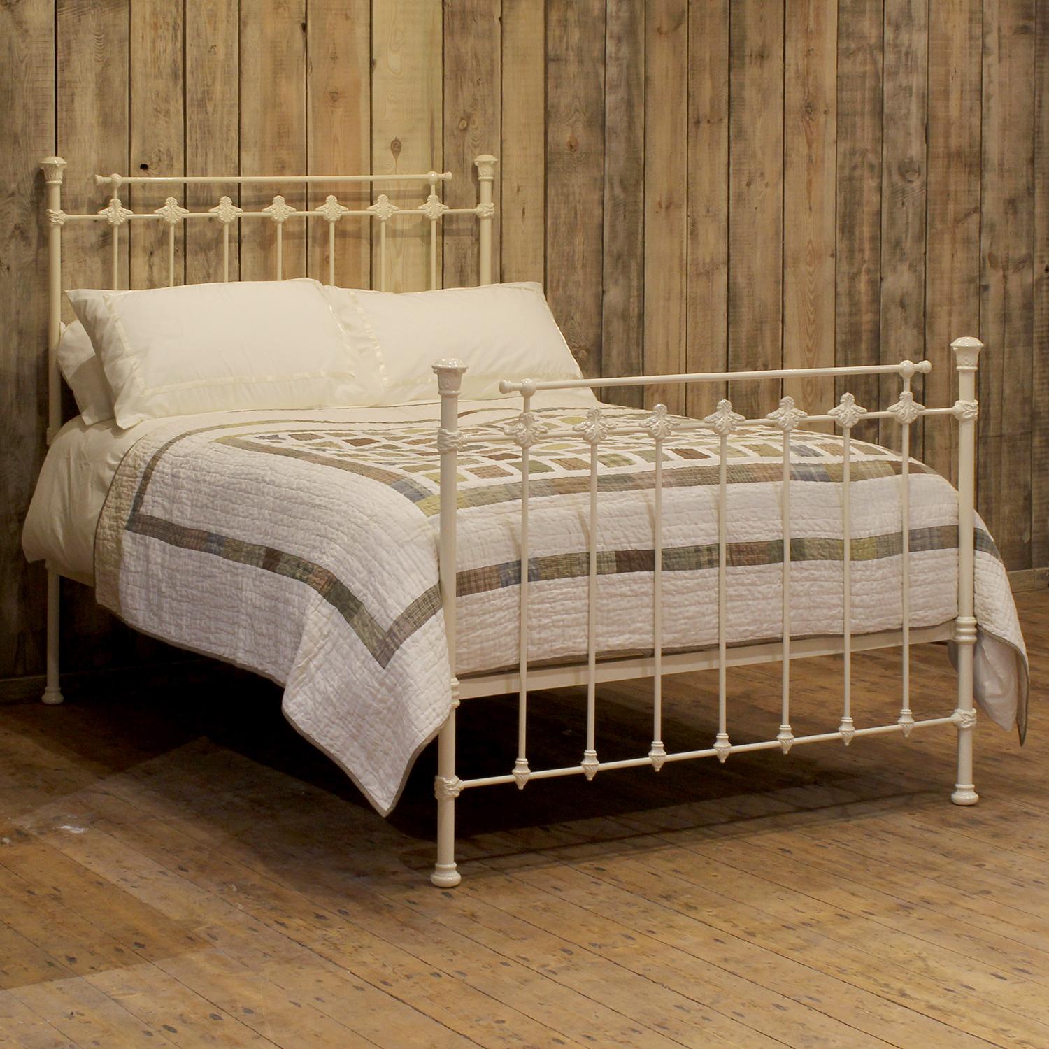 A Victorian cast iron bedstead finished in cream with decorative castings.

This bed accepts a double size 4ft 6in wide (54 inch or 135cm) base and mattress. 

The price includes a firm standard bed base to support the mattress.

The mattress,