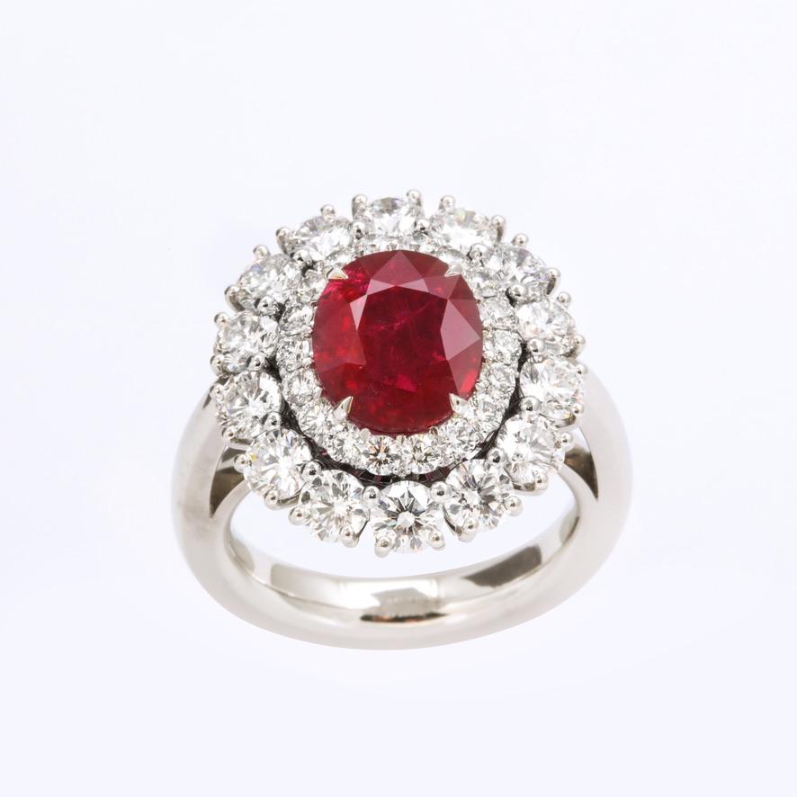 Bright red, completely natural and not heat treated Burmese ruby and diamond ring with two gemological certificates.  The ruby is a beautiful top gem quality stone and the diamonds are approximately F color and VVS-VS clarity.

1 oval Burmese ruby