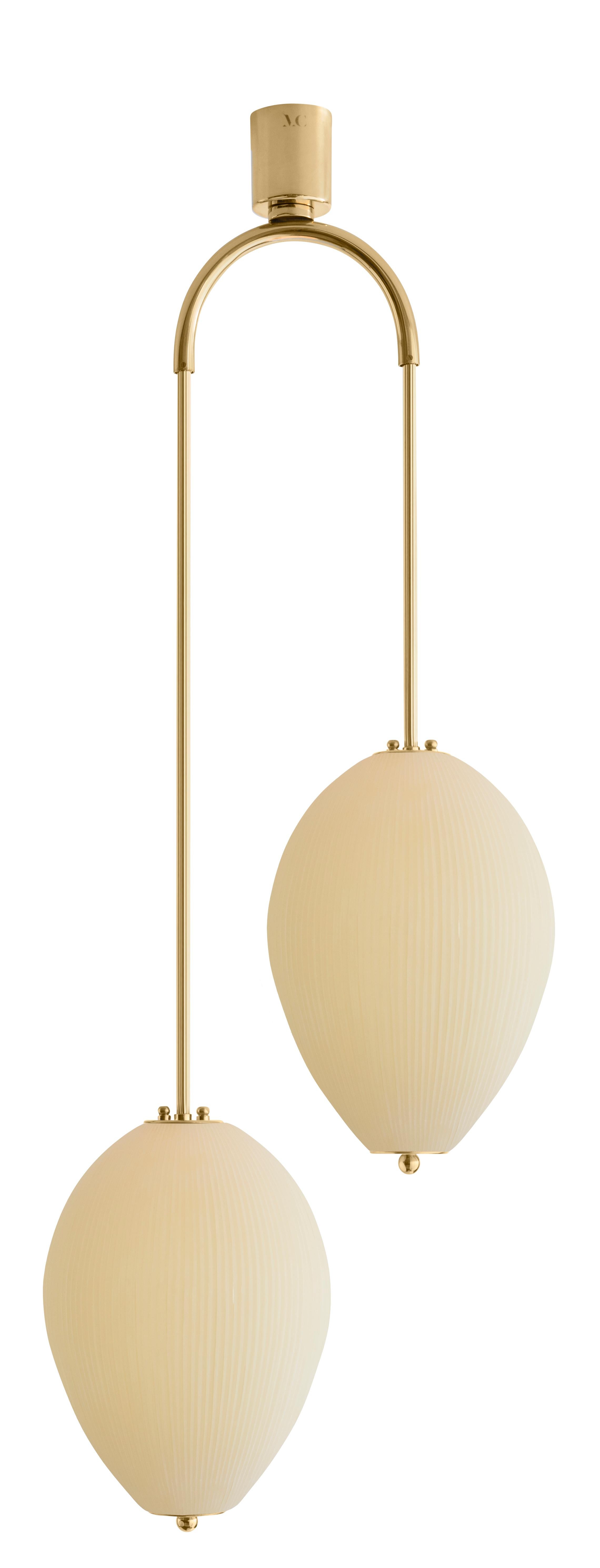Double chandelier China 10 by Magic Circus Editions
Dimensions: H 121.5 x W 44.3 x D 25.2 cm
Materials: Brass, mouth blown glass sculpted with a diamond saw
Colour: mustard yellow

Available finishes: Brass, nickel
Available colours: enamel soft