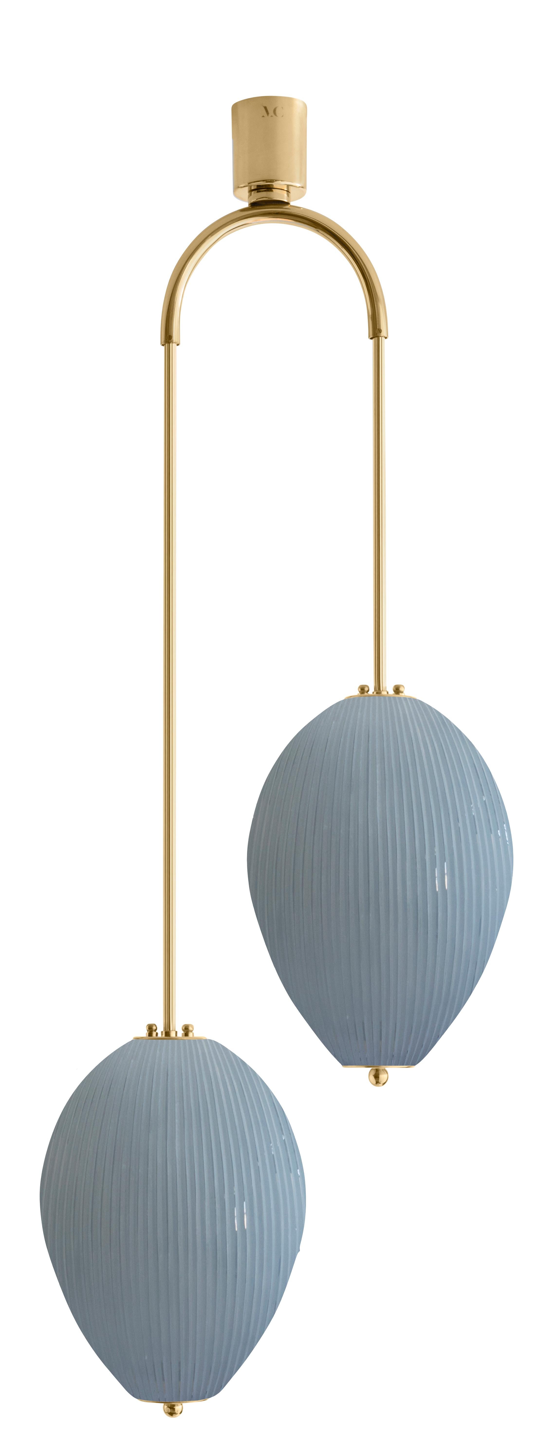Double chandelier China 10 by Magic Circus Editions
Dimensions: H 121.5 x W 44.3 x D 25.2 cm
Materials: Brass, mouth blown glass sculpted with a diamond saw
Colour: opal grey

Available finishes: Brass, nickel
Available colours: enamel soft