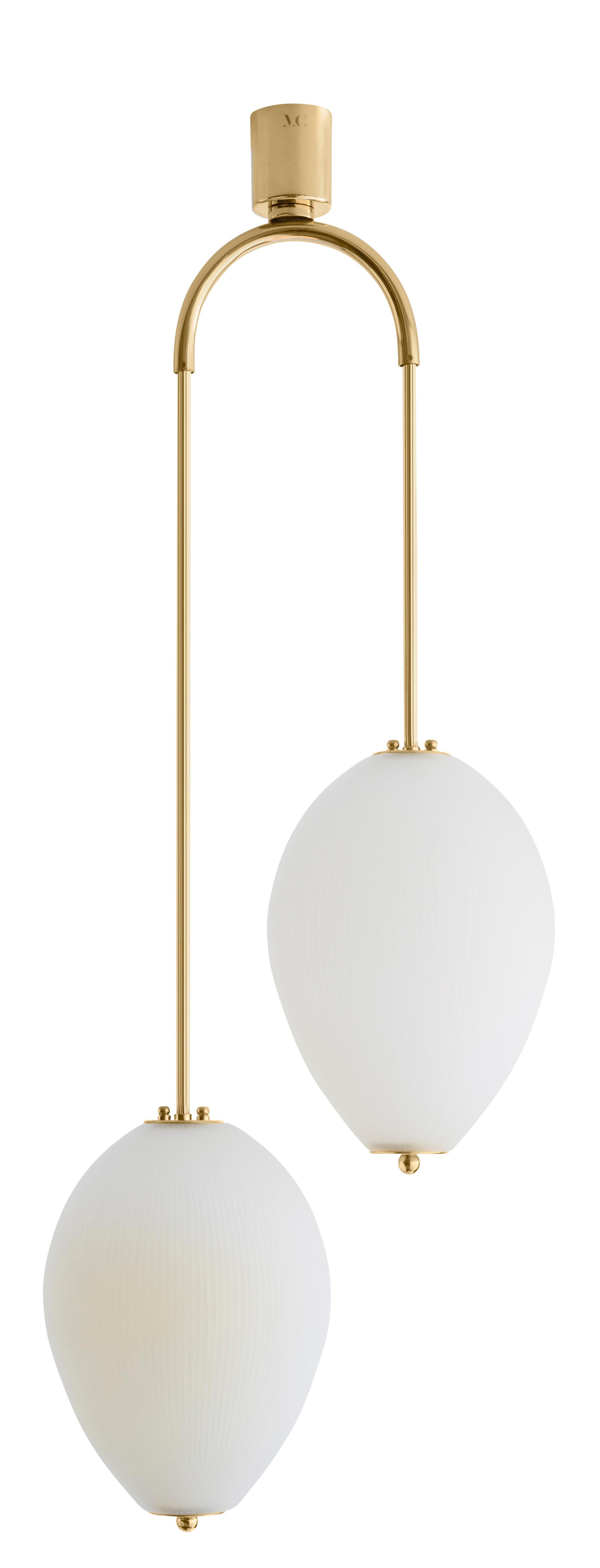 Double chandelier China 10 by Magic Circus Editions.
Dimensions: H 121.5 x W 44.3 x D 25.2 cm.
Materials: brass, mouth blown glass sculpted with a diamond saw.
Colour: ivory.

Available finishes: brass, nickel.
Available colours: enamel soft