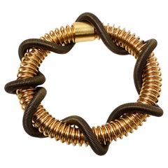 Bracciale a doppia spirale con filo geometrico verde e oro