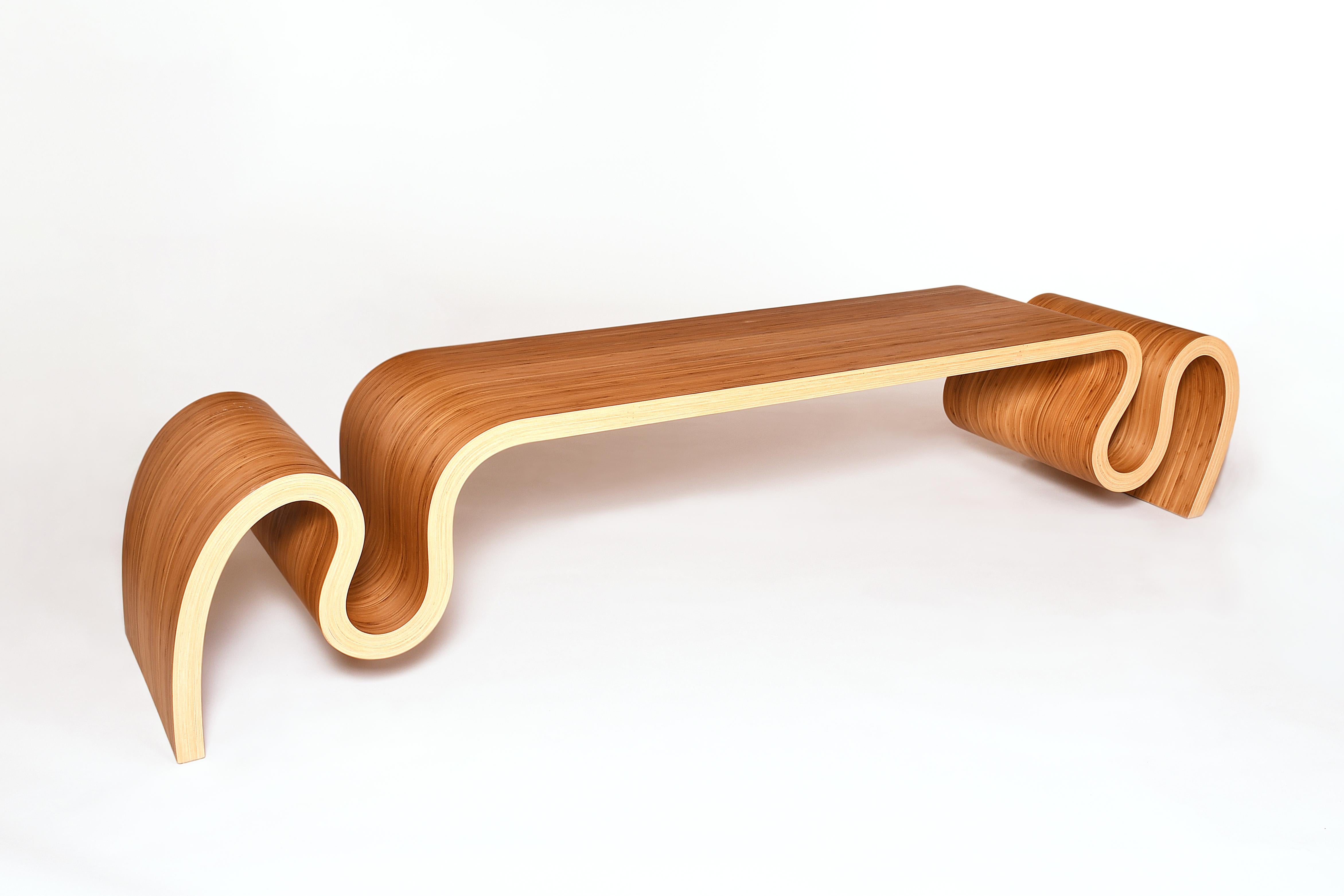 This bench has a very unique design, it's the result of many years of research on the technique of bent lamination. I created it in 2022 for a corporate customer, it was a part of four different benches for a building loby. The one showed on the