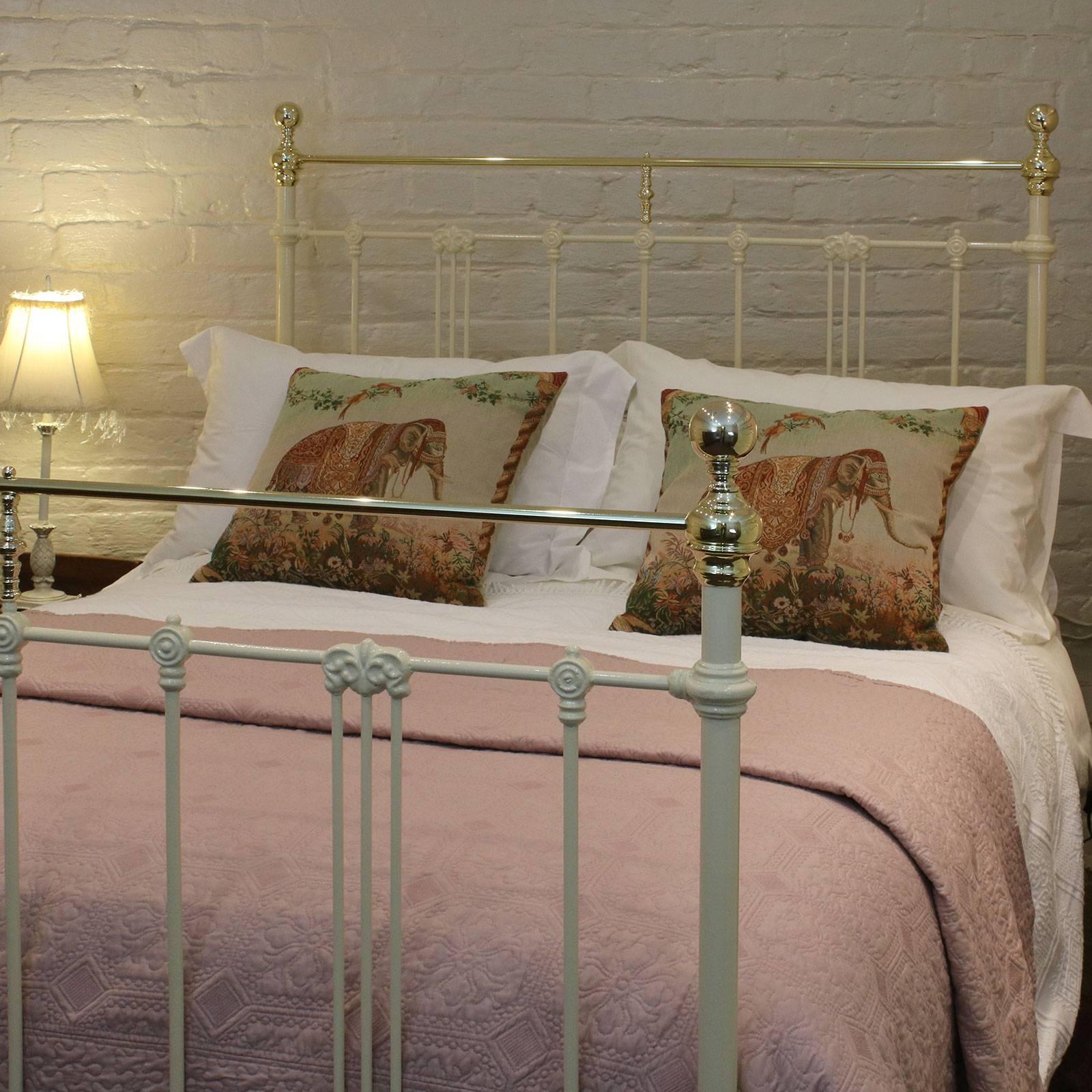 A brass and iron bedstead finished in cream with brass straight top rails and Art Nouveau style castings, circa 1900.

This bed accepts a double size base and mattress (54 inches, 4ft 6in or 135 cm).

The price is for the bed frame alone - the