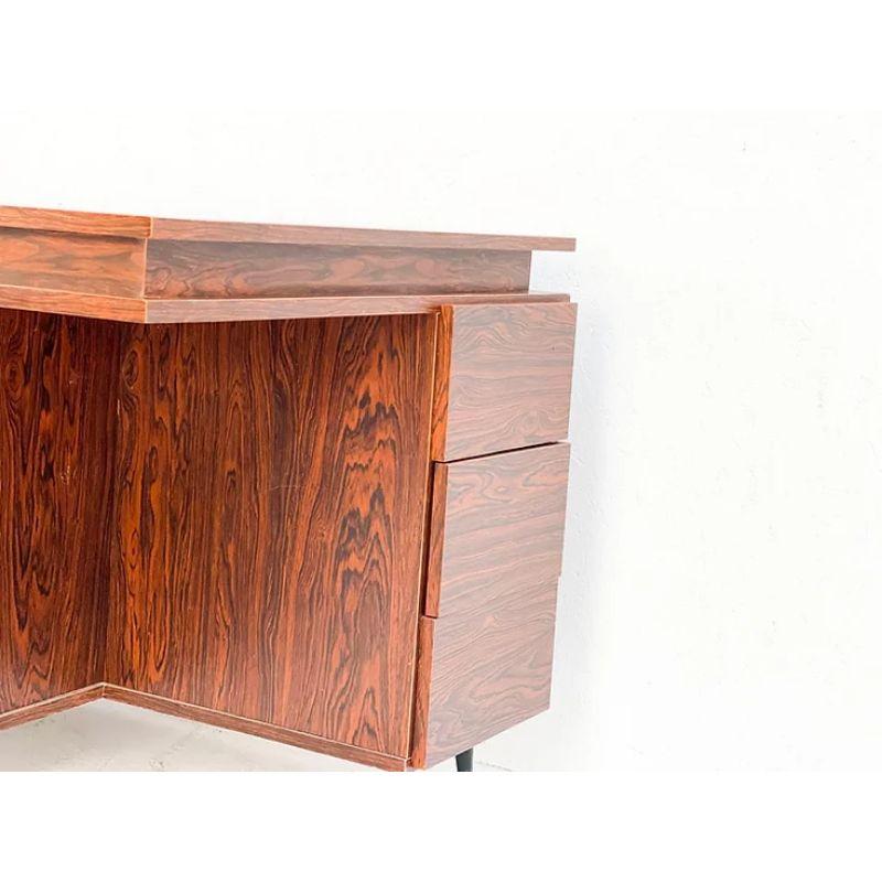 Double Desk with Side Drawers and Two Cabinets

A beautiful big fineer Belgian desk, designed and manufactured by an unknown designer. It was probably made in the late 1970s in Belgium. The desk features two places with each side drawers and two