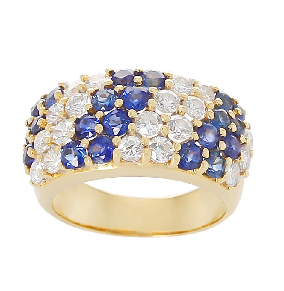 A double diagonal sapphire and diamond cocktail ring in 18 Karat Yellow Gold. Sapphires: 2.25 carats, Diamonds: 1.34 carats, Ring Size US 6.50.  Total Weight: 8.10 grams.