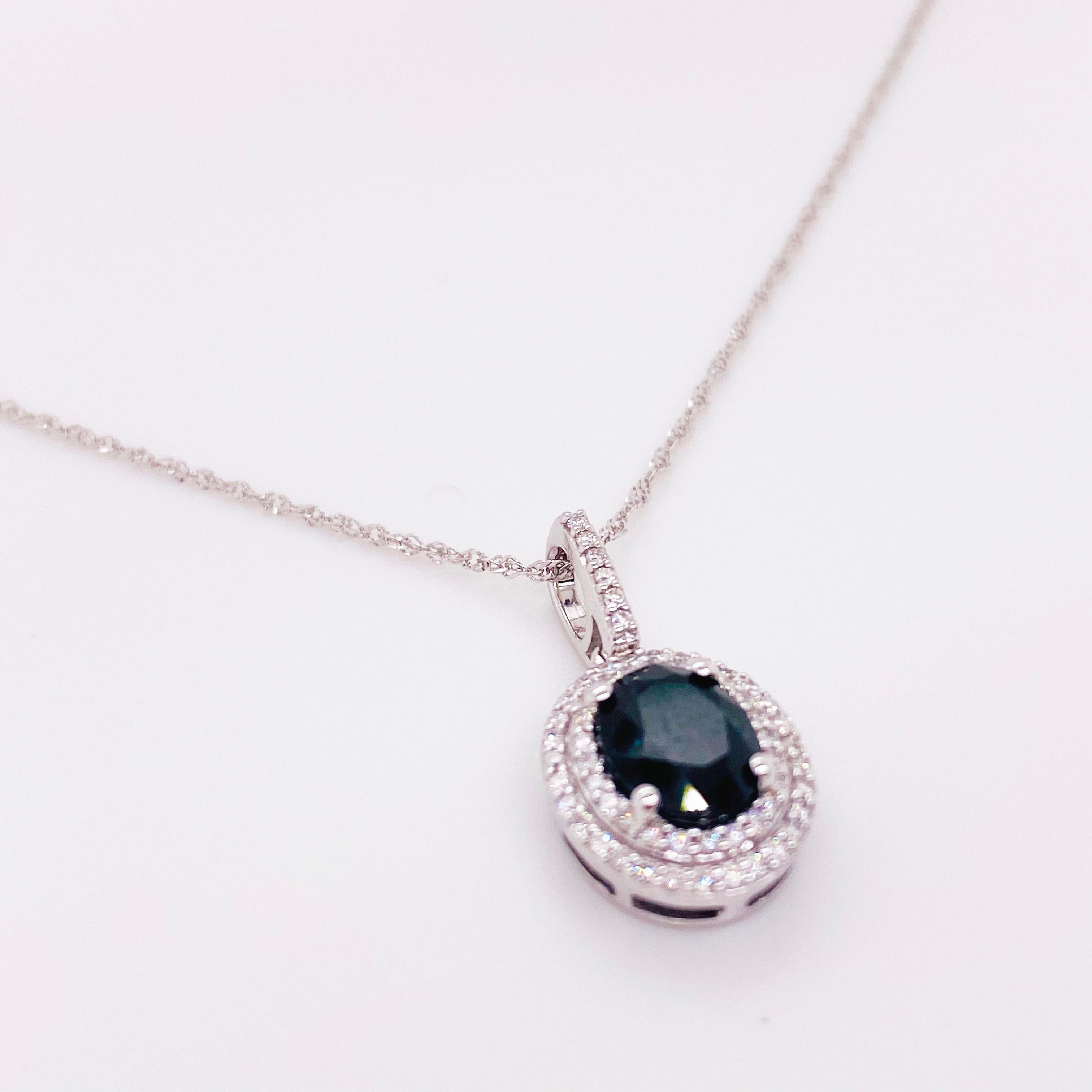 14K White Gold Diamond and Oval Sapphire Necklace With Double Halo of Diamonds:
This extraordinary necklace has 60 diamonds in a double halo and a diamond bail with an oval sapphire in the center that is set with four prongs.  The gorgeous pendant