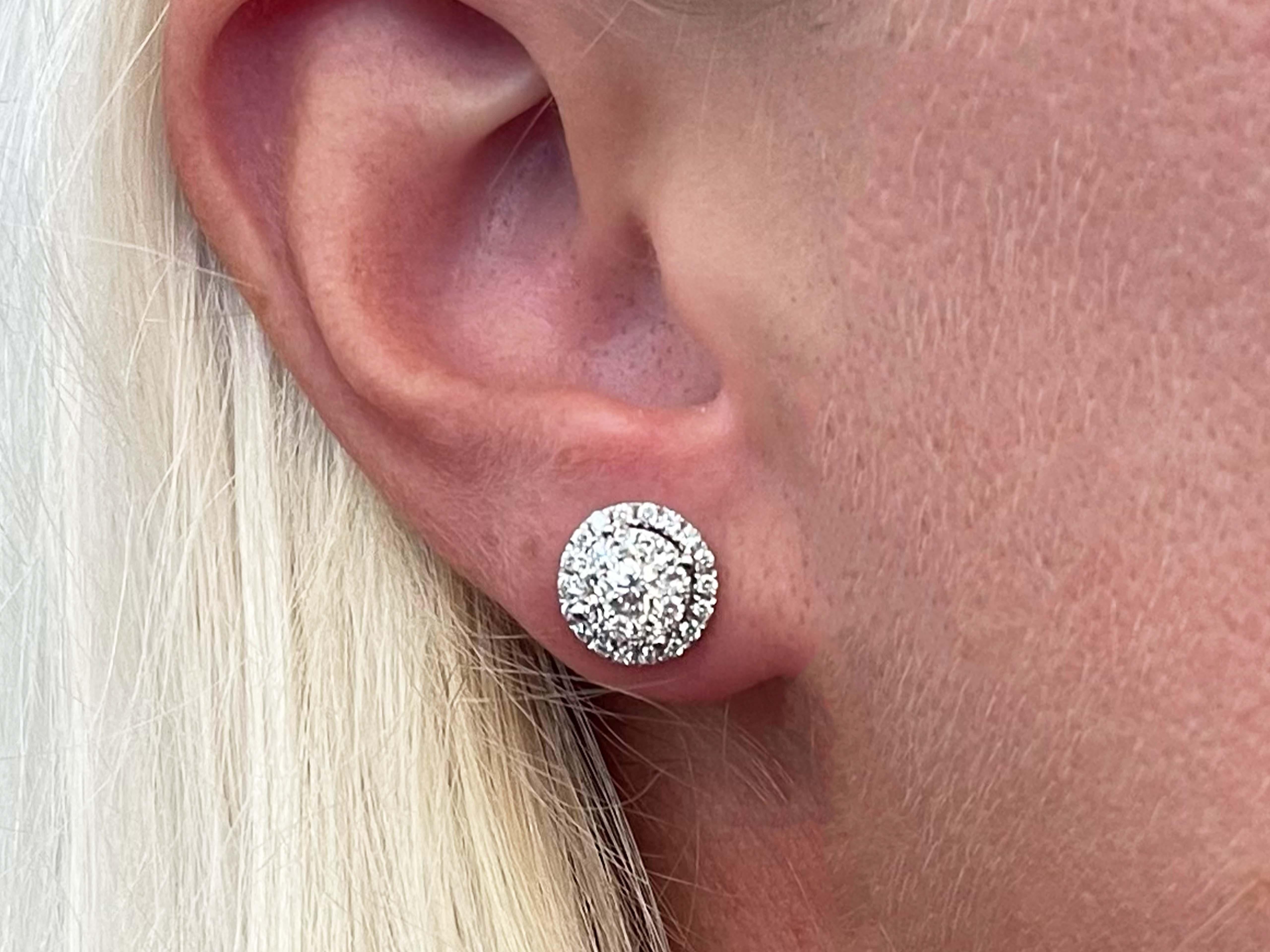 Earrings Specifications:

Metal: 18k White Gold

Earring Diameter: 9.94 mm

Total Weight: 3.4 Grams

Total Diamonds: 56

Diamond Color: G

Diamond Clarity: VS

Diamond Total Carat Weight: 0.70 carats

Condition: Preowned

Stamped: 