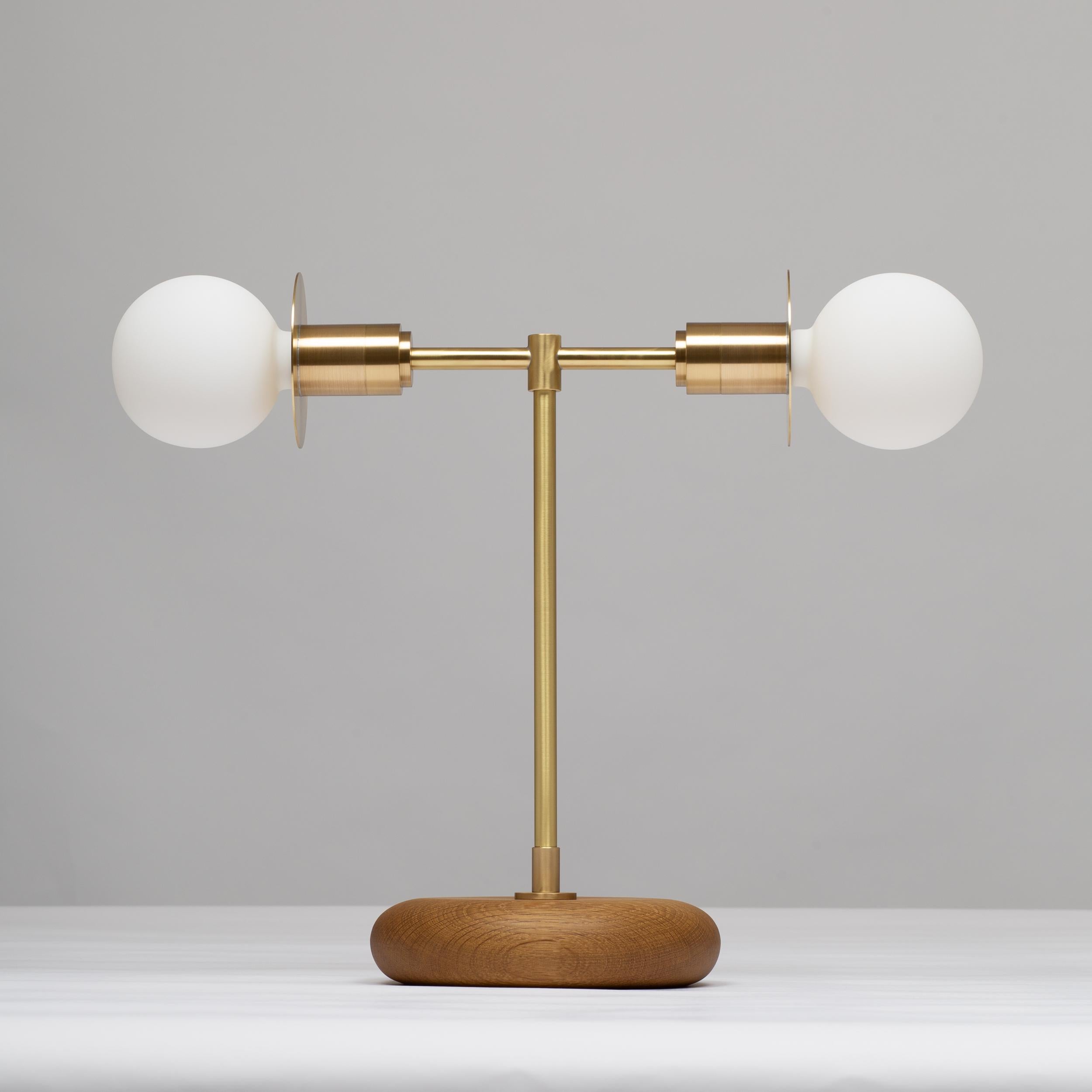 Handturned English Smoked Oak Pebble Table Lamp. Pure Monocoat natural oil finish.
Solid brass, Satin finish. Spun Brass Discs. Lacquered. 
Inline LED dimmer. Linen Fabric Cable.
2000K - 2800K  95CRI
1200 Dim to Warm Lumens
Sphere III bulbs