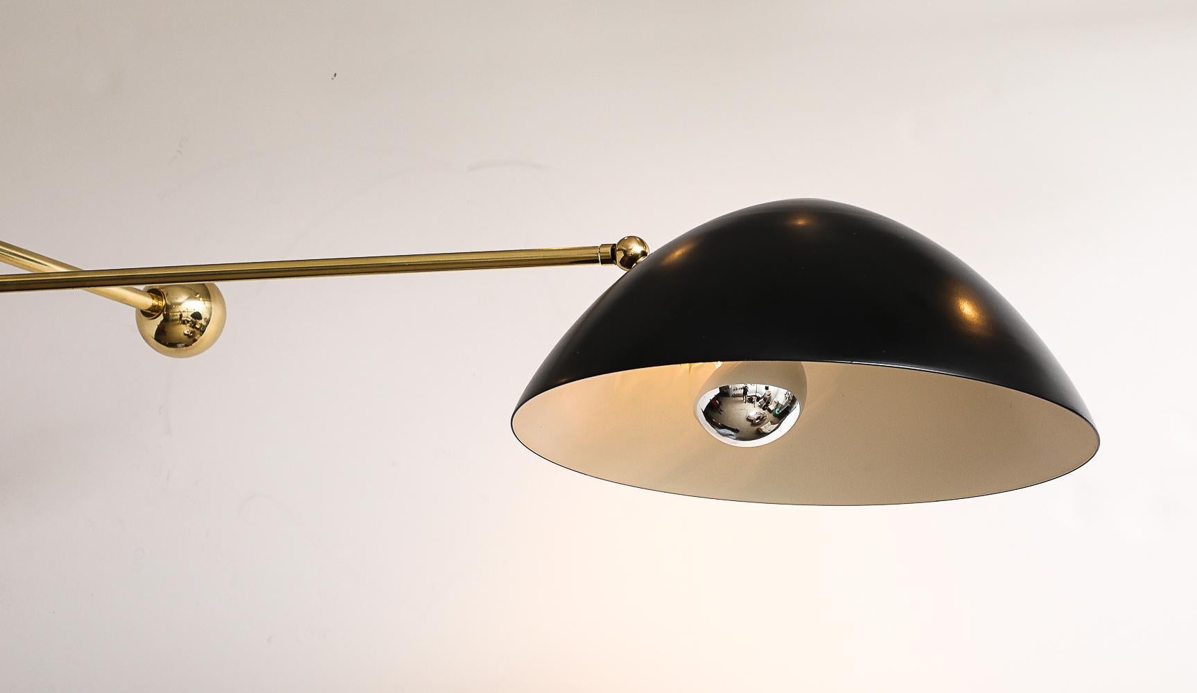 Painted aluminum, brass. Painted aluminum shades with brass rods, mounts & counter-weighted orbs. Each shade has 1 x E26 (standard Edison) socket. 


*We often have a few of these fixtures readily available in our inventory, but if by chance we