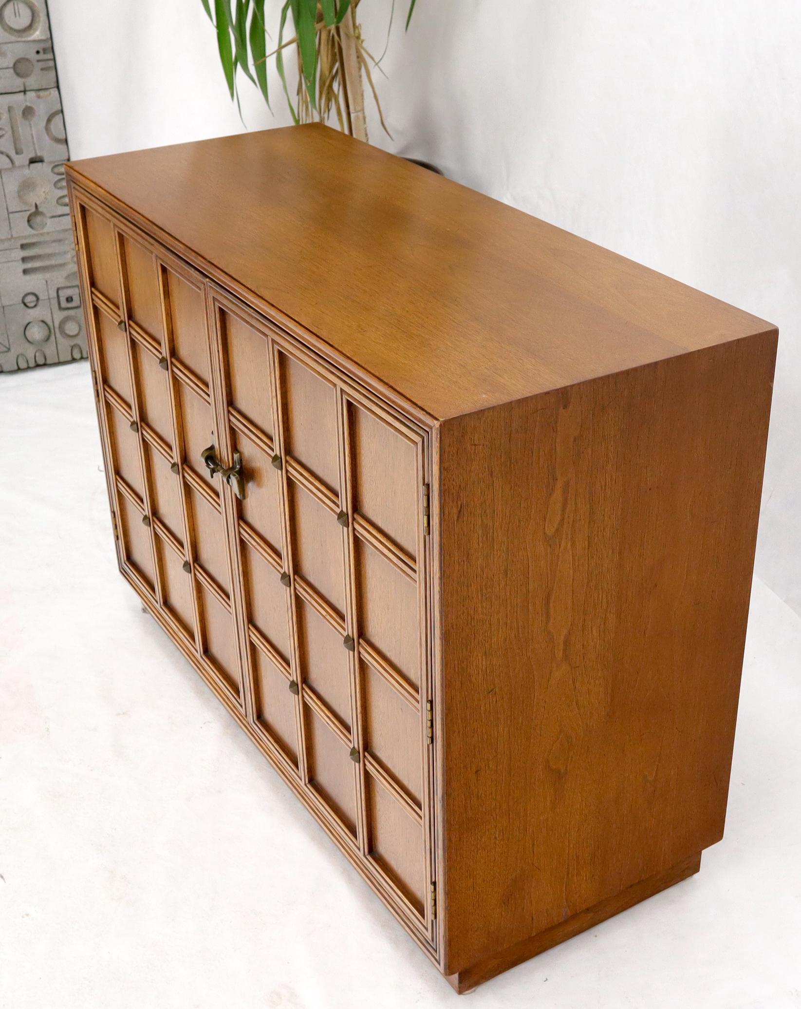 Mid-Century Modern lattice and studs front two doors credenza cabinet server or console. Very decorative high quality piece built by Henredon.