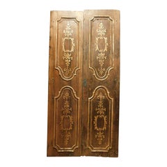Puerta doble, de nogal con decoración dorada, Italia