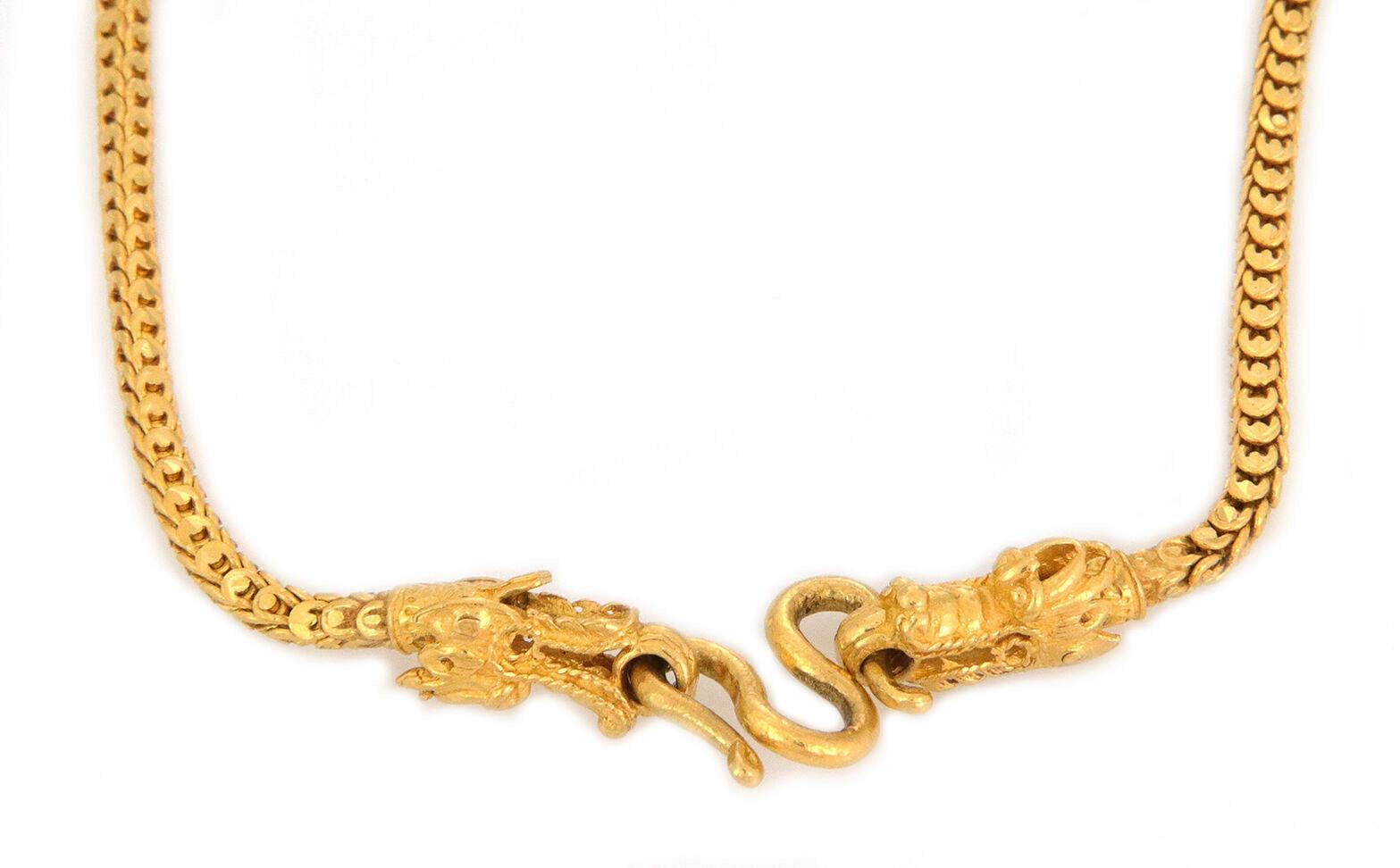 This is an impressive dragon necklace; it is crafted from 24k gold featuring a box shape dragon scale link 3mm thick chain. On one end of the chain has a detailed sculpted dragon head with a ring in its mouth, the other end of the chain has another