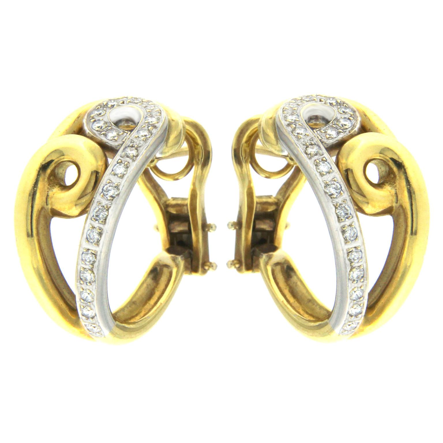 Description:
These stunning hoop earrings from the Double Drop collection feature a slender round barrel design, in keeping with the collection's signature style. Crafted entirely from yellow gold, each earring is adorned with a double drop in the