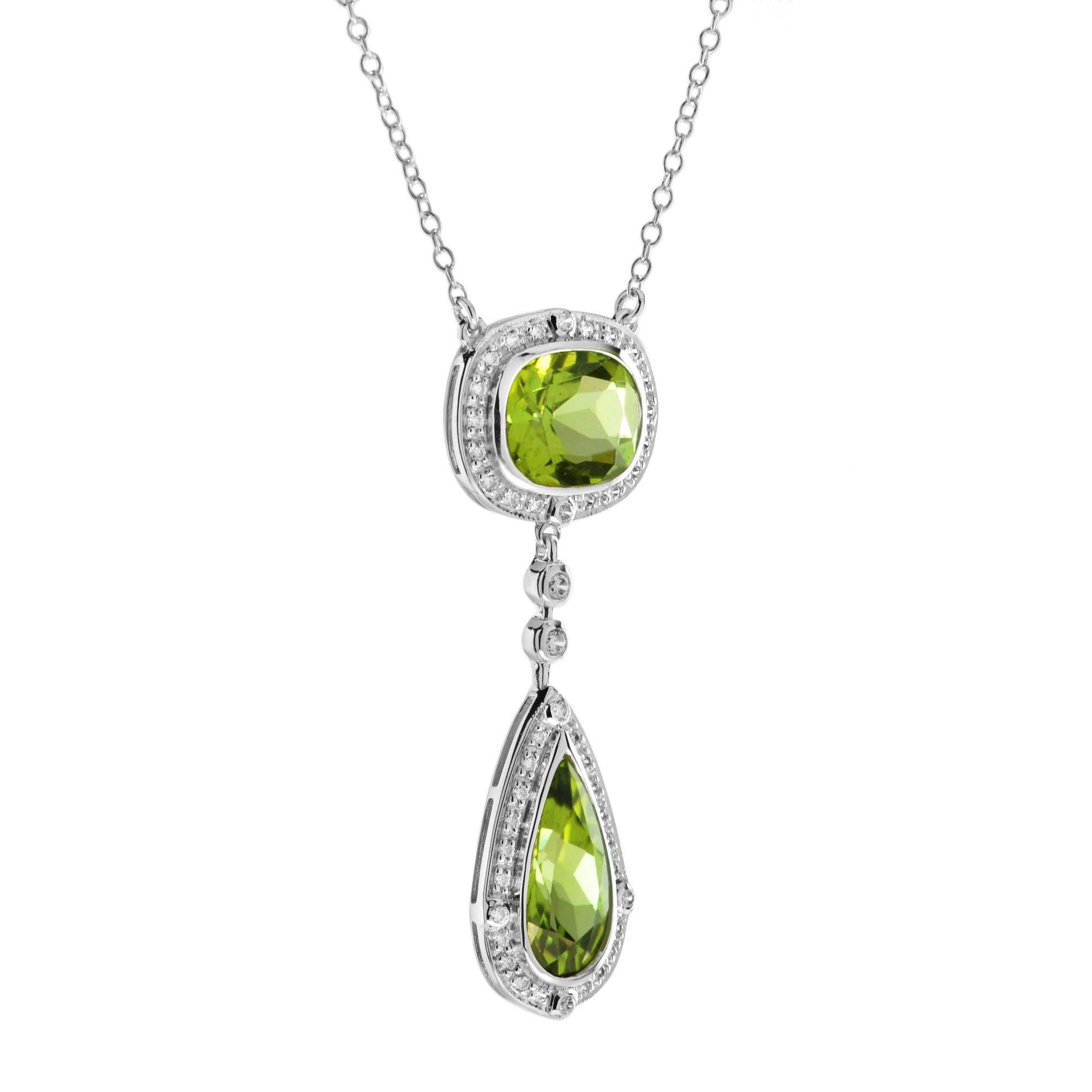 Create a stunning and adorable look with this double-drop peridot and diamond accent necklace! Cut to the mesmerizing, faceted cushion and pear shape. Adding to the stunning design, 0.37 carat round diamonds beautifully outline the focus gemstones.