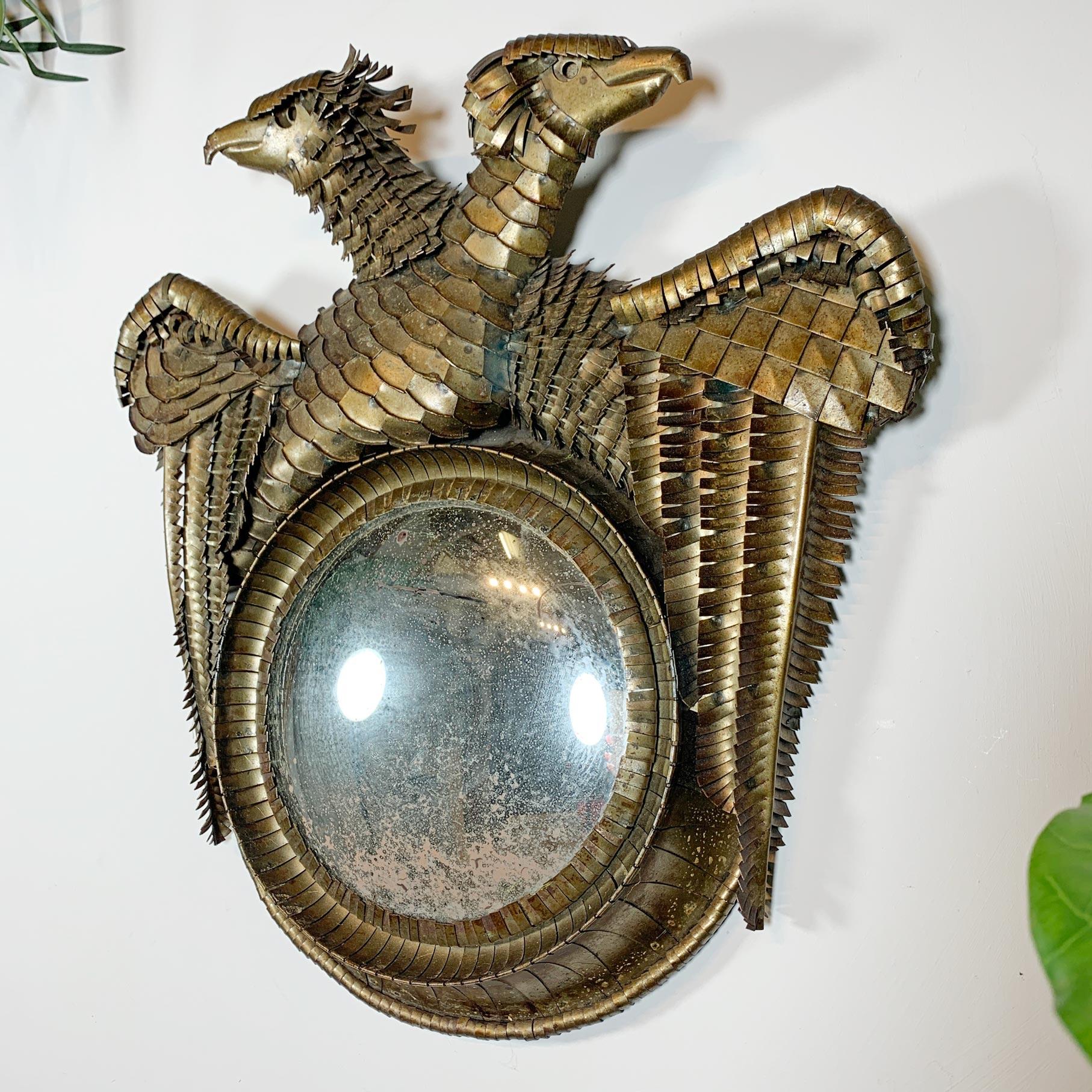 A superb double Eagle convex mirror created by the French Artist, sculptor and jewellery designer Leon Masson (1911-1984) dating to the early 1950's, the convex mirror sits within the frame, which has been crafted by Masson using cut and welded