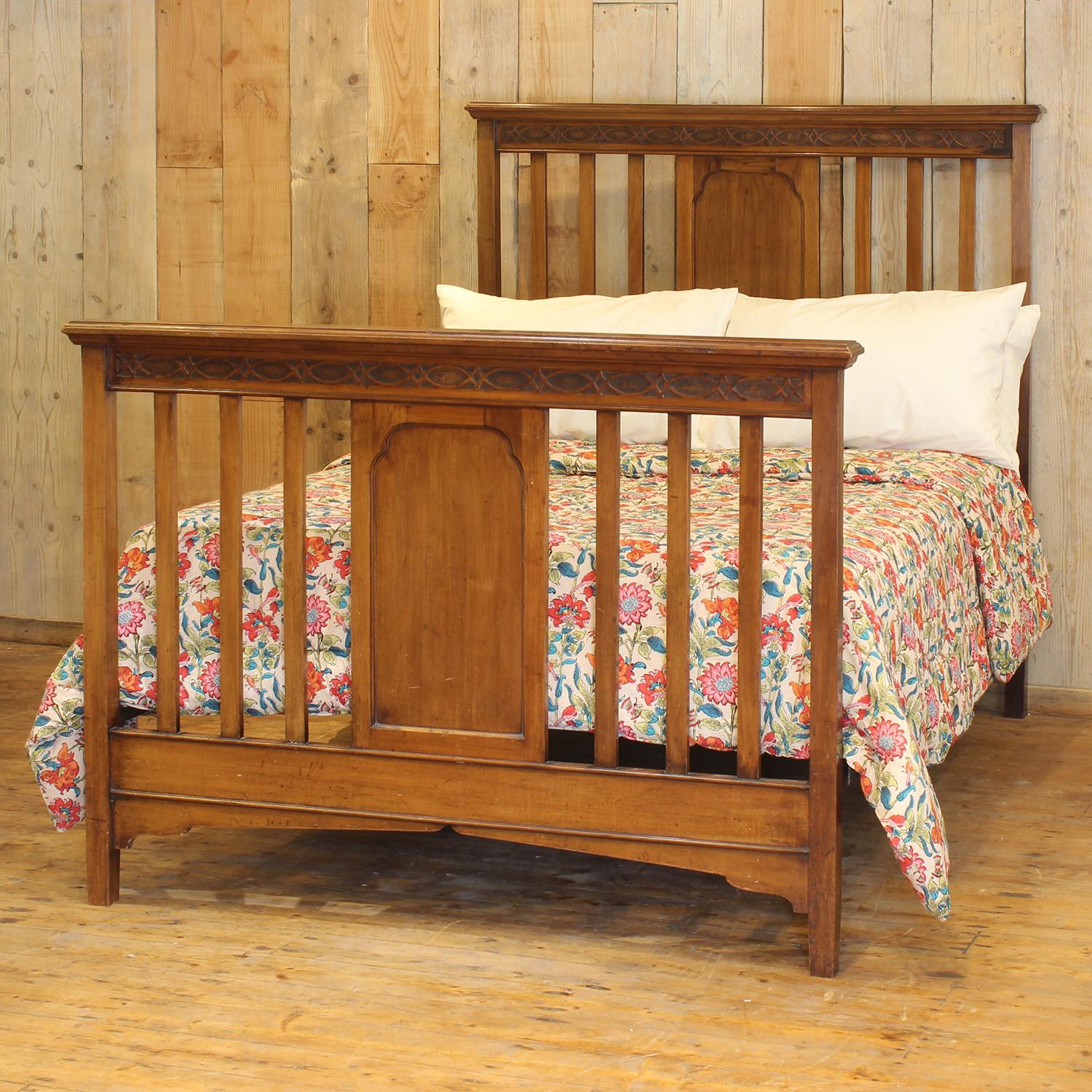 Add a touch of timeless elegance to your home with this stunning antique double bed, crafted in the north of the UK around 1910. Made from solid walnut, this beautifully preserved piece blends classic Edwardian design with exceptional build