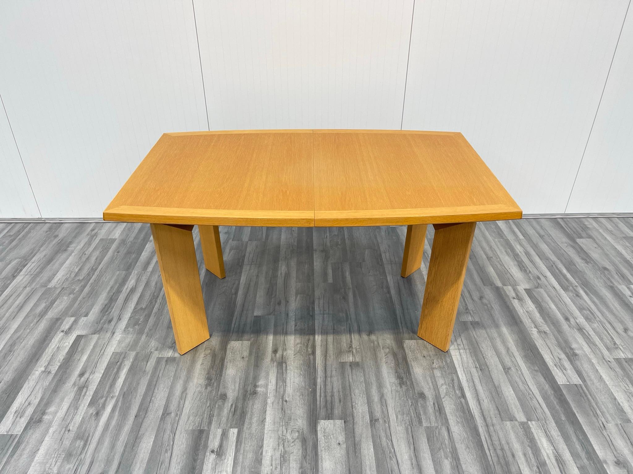 This is a beautiful dining table, designed and manufactured in Denmark. This cleverly designed and elegant table is relatively compact and space saving when unextended but features two additional leaves that fit easily in place to allow the table to