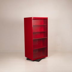 Double-face rotating display cabinet in red lacquer by Arflex, 1980s