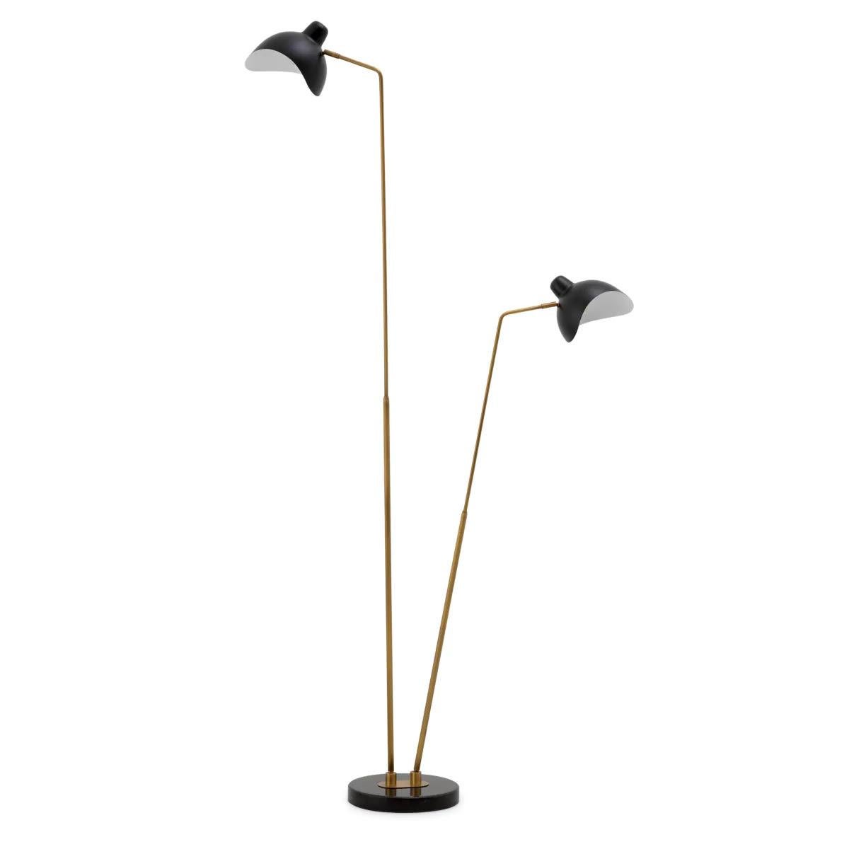 Double floor lamp, antique brass and black finish, black marble base

This double floor lamp echoes the aesthetic of designer lamps from the 1950s and 1960s.
Its lampshades are reminiscent of vintage riding helmets. Black in colour, they are