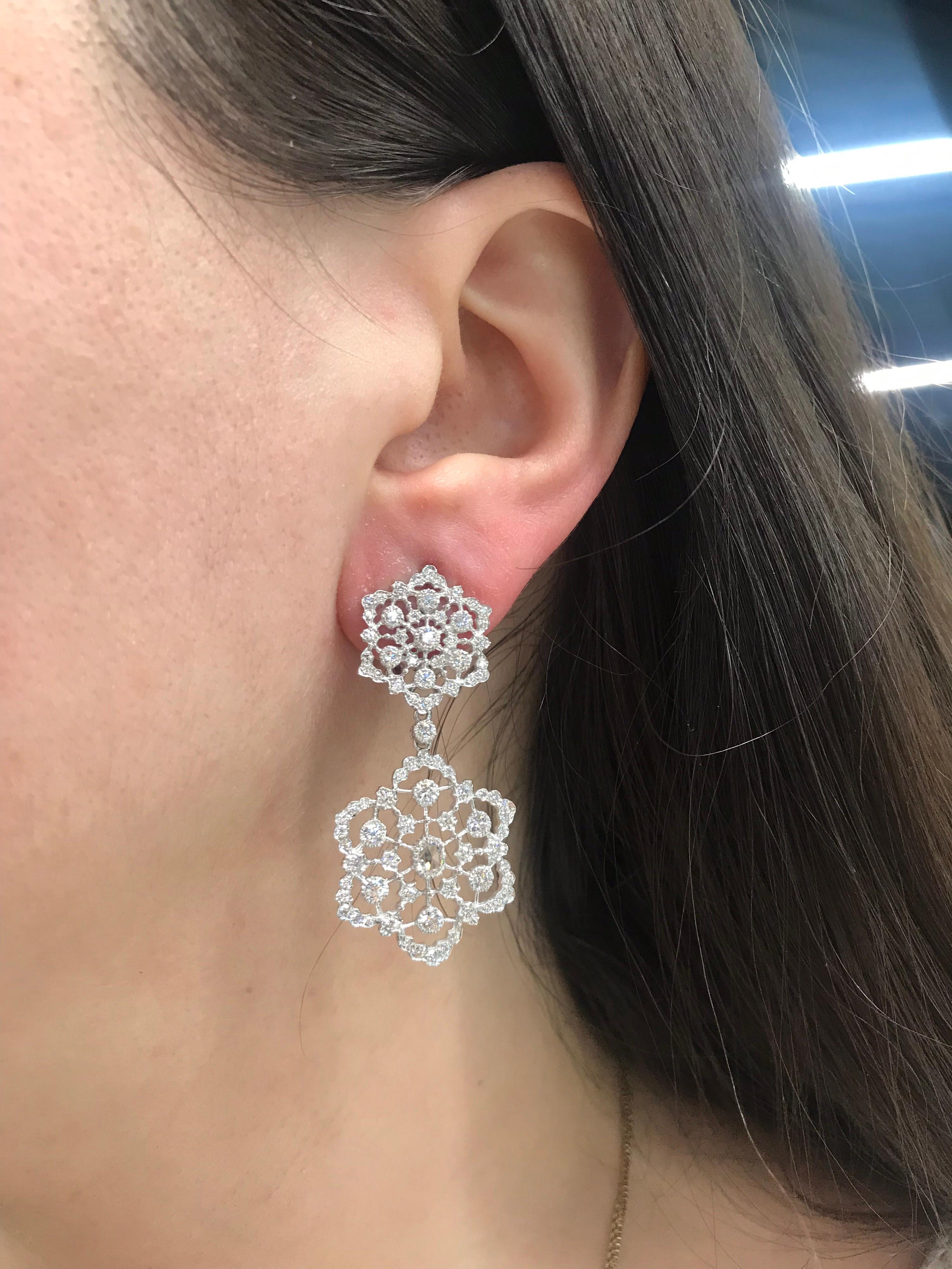 18K White gold drop earrings featuring a diamond floral motif with 174 round brilliants weighing 2.54 carats.