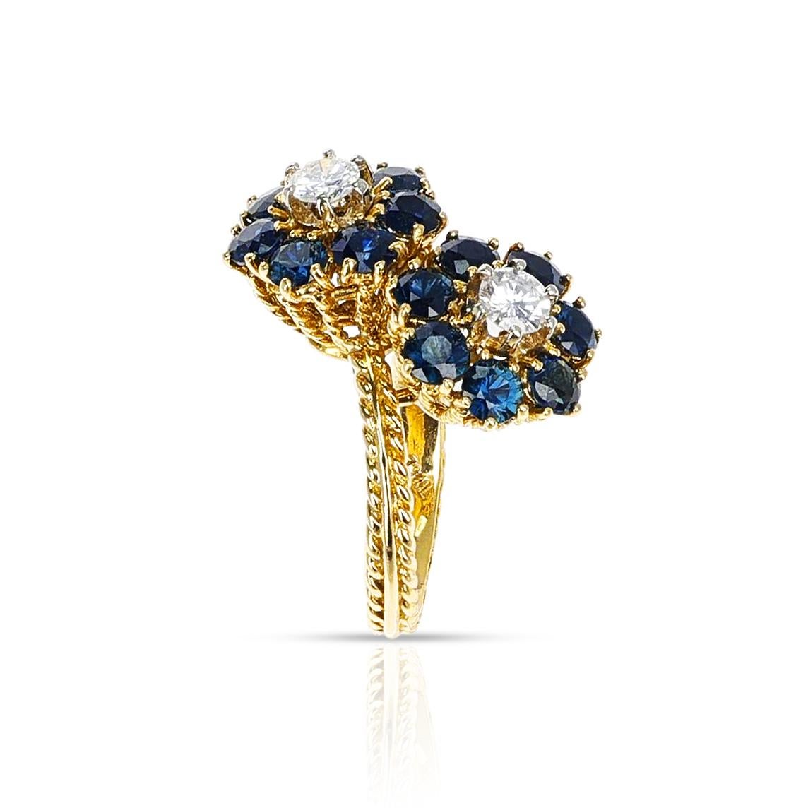  A beautiful Double Floral Sapphire and Diamond Ring made with 18 Karat Ropework Yellow Gold. The diamonds weigh appx. 0.60 carats. The total weight is 8.60 grams. The ring size is US 5.50. 