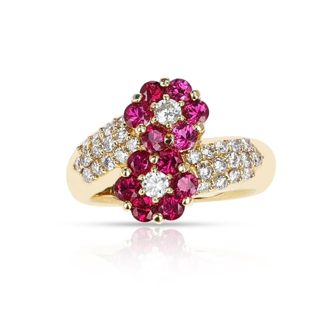 A Double Flower Ruby Ring with Diamonds made in 18 Karat Yellow Gold. The diamonds weigh 0.55 carats. The total weight of the rubies is 1.14 carats. The ring size is US 5.75. The total weight of the ring is 7.30 grams. 