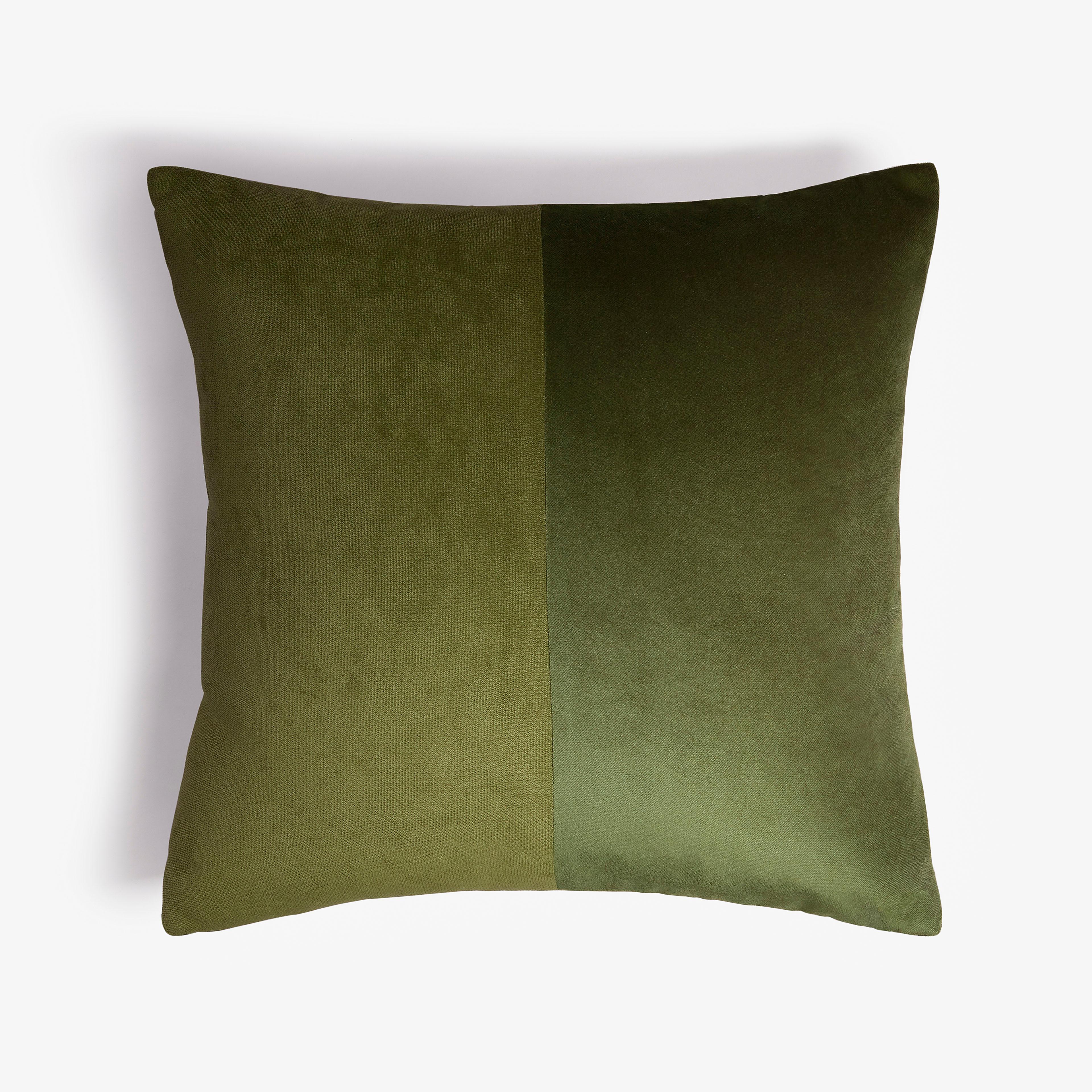 brown couch with green pillows