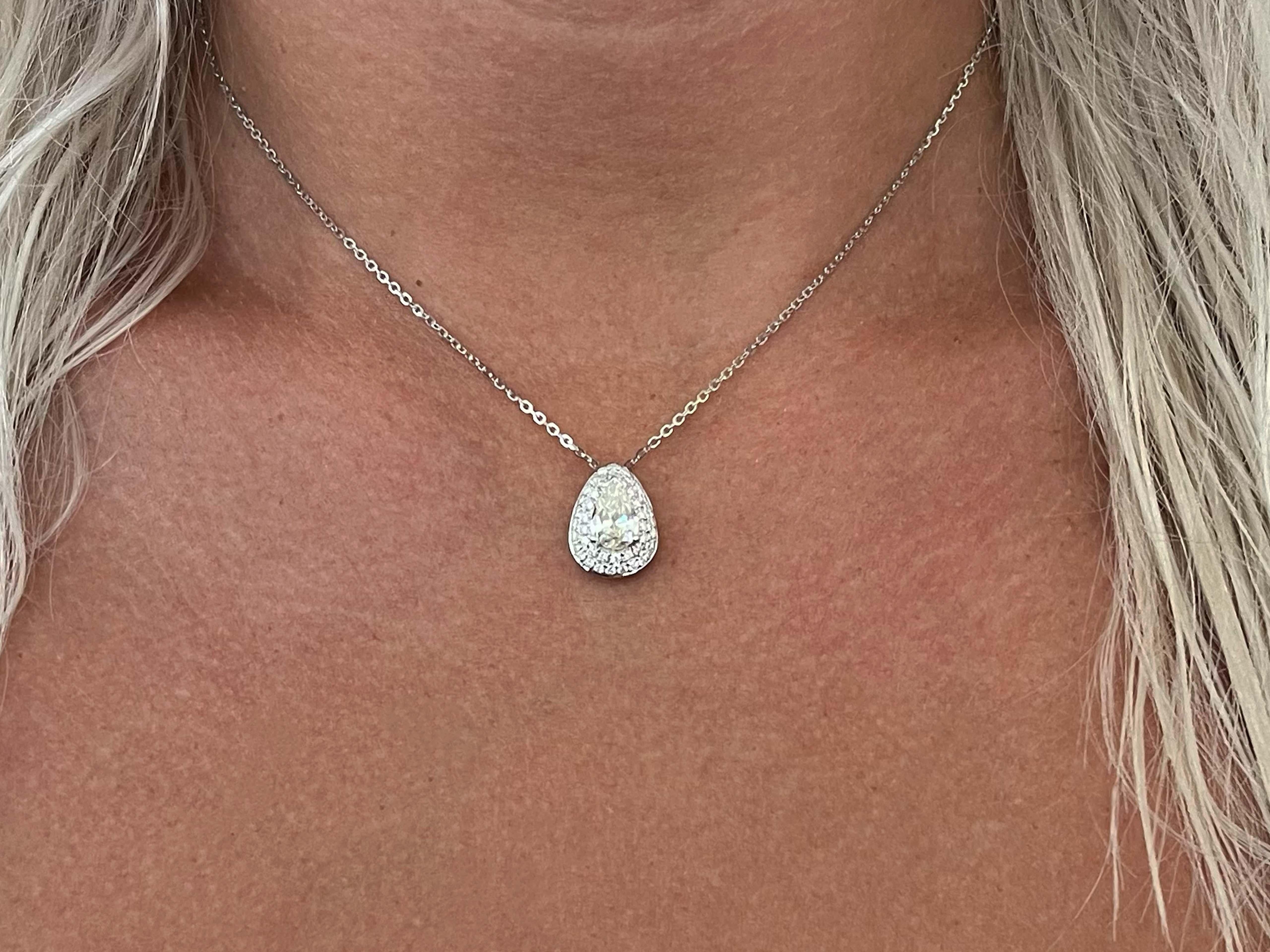 This pendant features a 1.02 ct pear shaped diamond and is surrounded by a gorgeous double halo of 43 round brilliant cut diamonds totaling 0.44ct. The pendant is in 18k white gold and comes on a 16