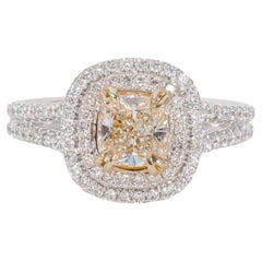 Double Halo Ring in 18K WG with Fancy Yellow Cushion Diamond Center. D1.37ct.