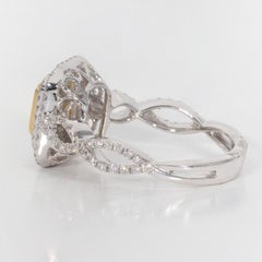 Double Halo Ring with Very Light Yellow Radiant Cut Diamond Center.  D1.65ct.t.w