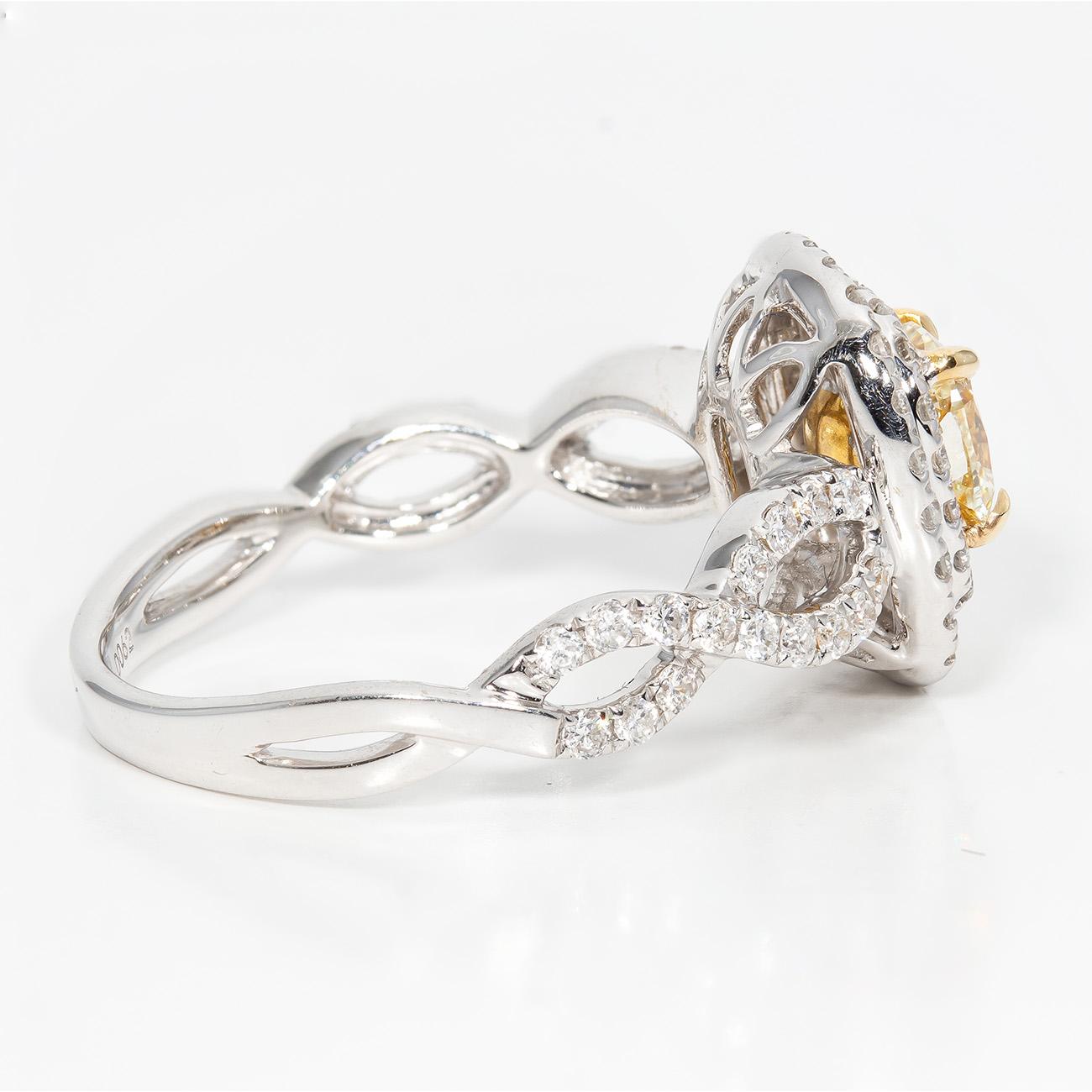 Double Halo Split Shank Ring with Fancy Yellow Cushion Diamond Center. D1.34ct. In New Condition For Sale In Los Angeles, CA
