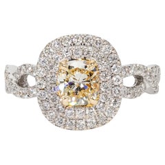 Double Halo Split Shank Ring with Fancy Yellow Cushion Diamond Center. D1.34ct.