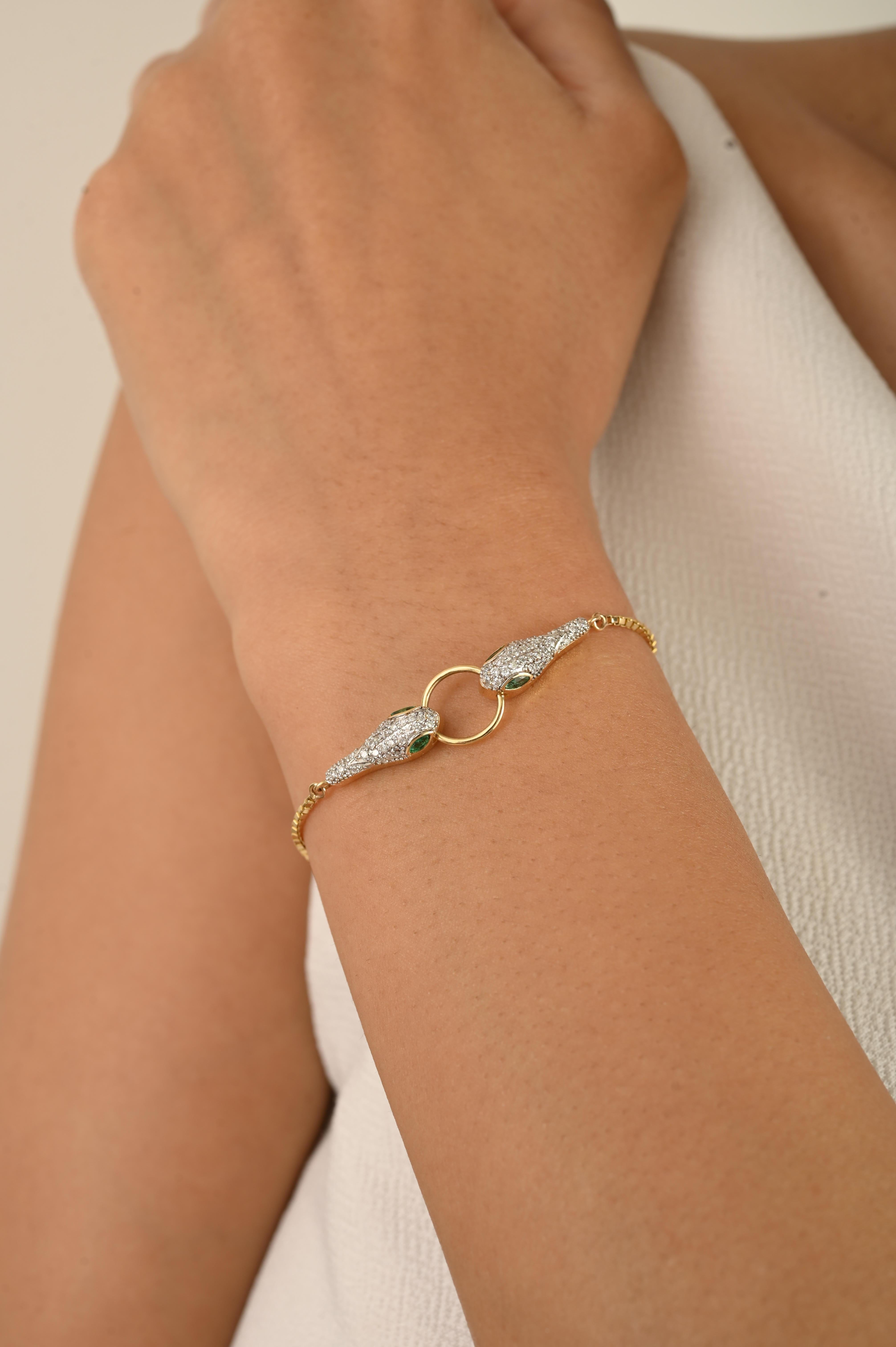 A striking symbol of elegance and strength, this handcrafted bracelet in 18k yellow gold features a captivating twin snake head motif. The heads are adorned with glistening diamonds totaling 0.31 carats, adding brilliance and texture to the