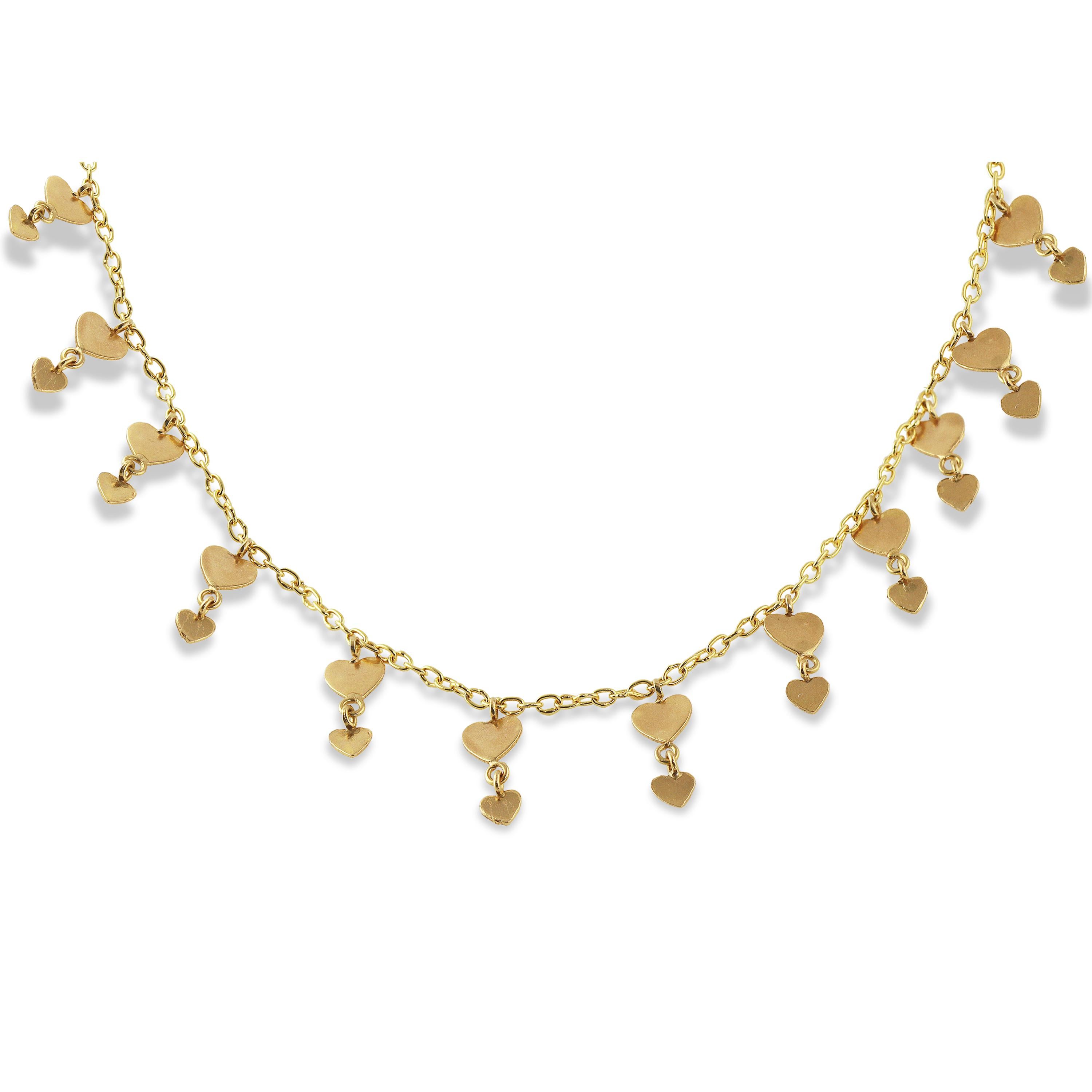 Fifty-four, eye-catching 22k gold sequins are featured in the exquisite necklace. The necklace which features two sizes of hearts, hanging on a hand-made chain, lends a bohemian elegance to this special piece.   

The necklace, measuring 17