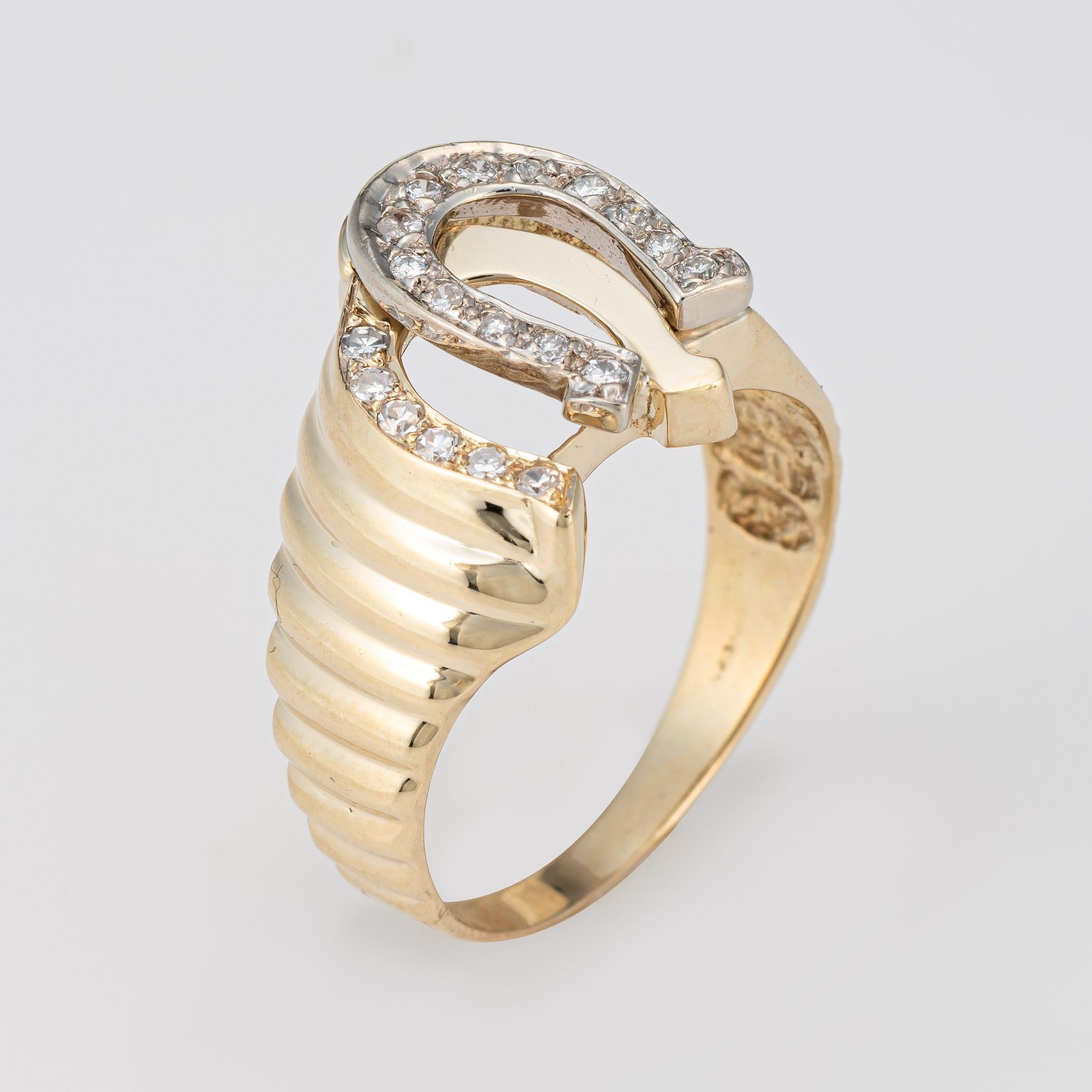 Stylish vintage double horseshoe ring crafted in 14 karat yellow gold (circa 1970s). 

19 diamonds total an estimated 0.10 carats (estimated at I-J color and SI2-I3 clarity).  

The double horseshoe design is double the luck and prosperity, for a
