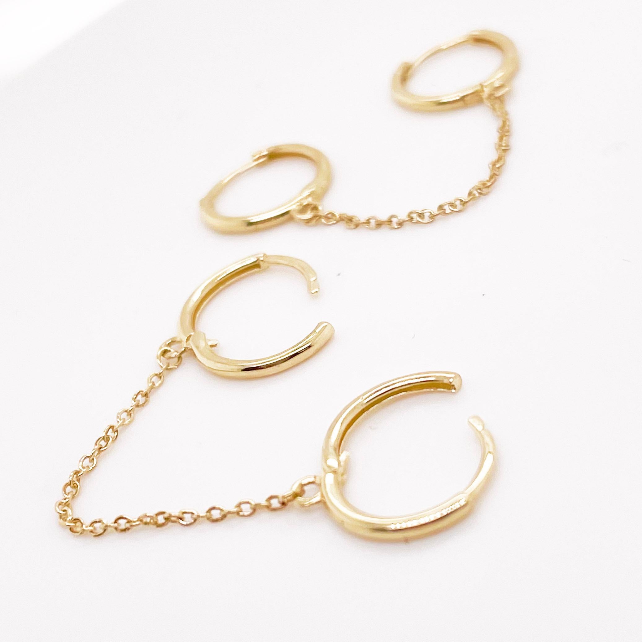 Trendy double huggie hoop earrings! This design is the most popular hoop earring style in 2022 fashion. The earrings have two huggies that are connected by a cable chain. The earrings is meant to be worn on an ear with at least 2 ear piercings. The