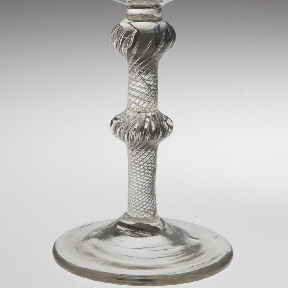 Heading : Georgian air twist wine glass 
Date : c1750
Period : George II
Origin : England
Colour : Clear
Bowl : Round funnel
Stem : Double knop multi spiral air twist
Foot : Conical
Pontil : Snapped
Glass Type : Lead
Size : 14.5cm tall,  6cm bowl