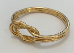 Double Knot Bangle Chiseled Yellow 18 Karat Gold