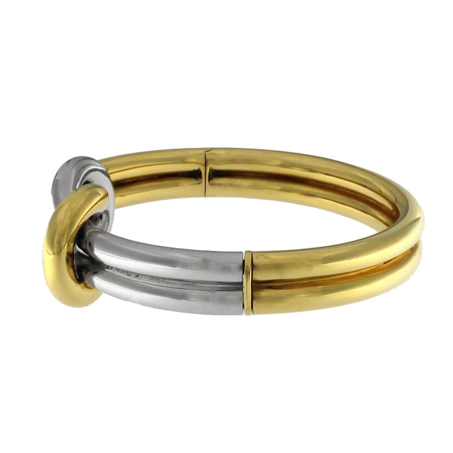 Double knot bangle in yellow gold and white gold
Extremely elegant this sailor style set
diamenter of the  bracelet 6x5 cm
The total weight of the gold is GR 46.70 
Necklace is available
Stamp 10 MI 750

