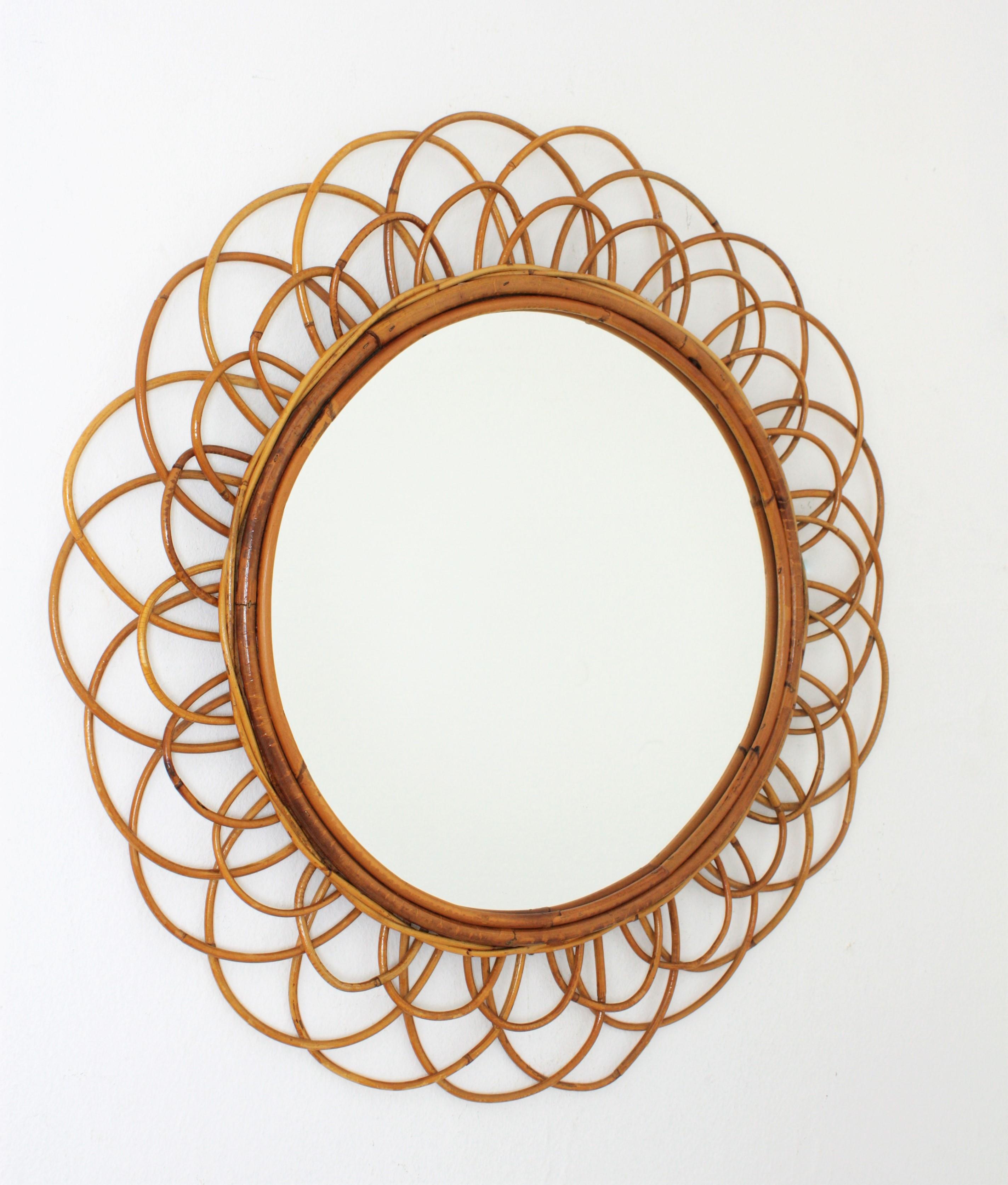 Beautiful handcrafted flower shaped rattan wicker mirror with two layers of cane petals as frame. France, 1950s-1960s
A piece will all the taste of the Mediterranean French Riviera, beautiful placed alone but also interesting combined with other
