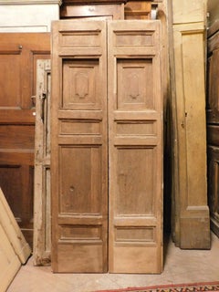 Double-leaf door in walnut with small opening windows, Italy