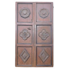 Puerta de dos hojas lacada y con rosetas talladas, Italia